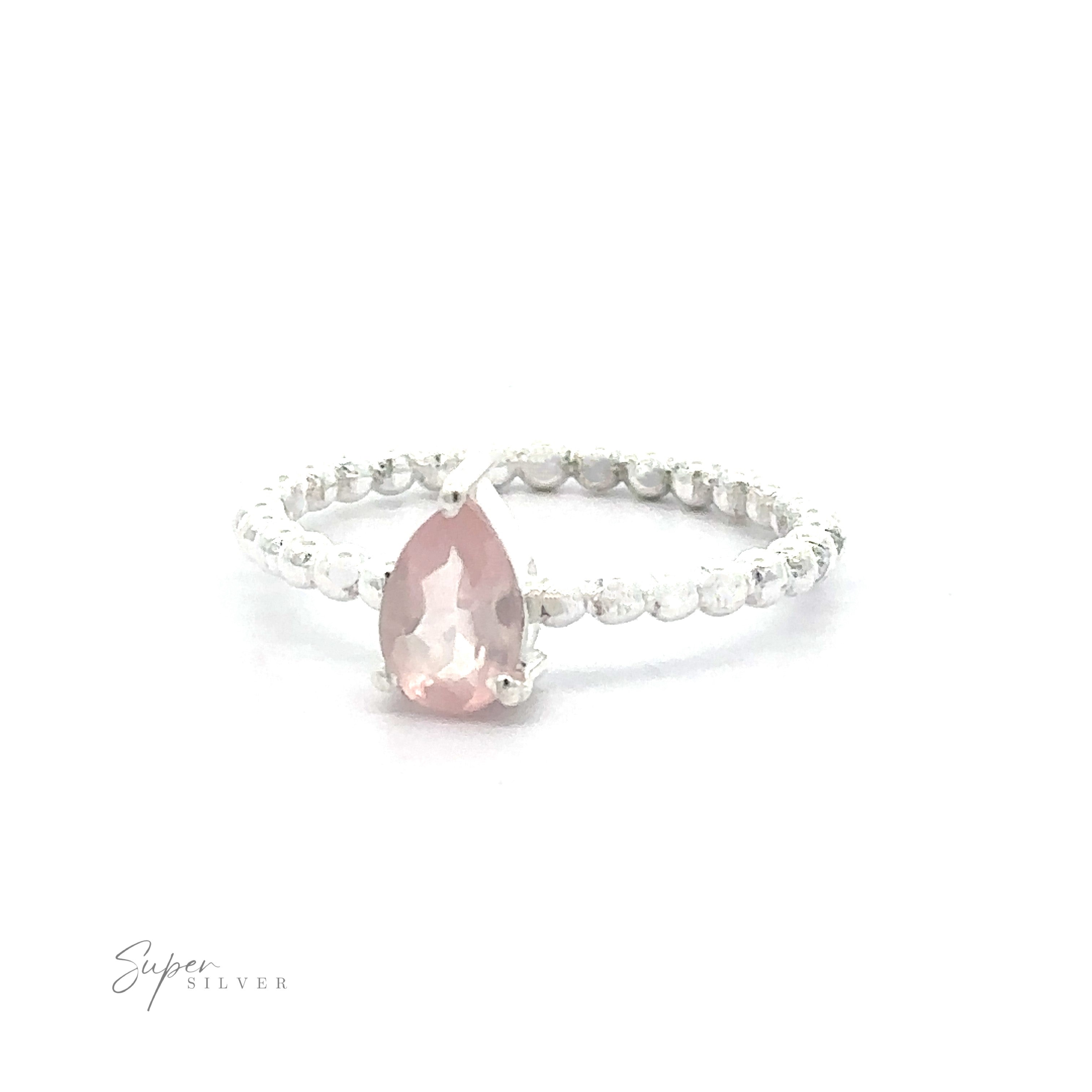 A Sparkling Teardrop Gemstone set in a .925 sterling silver ring with a beaded band.