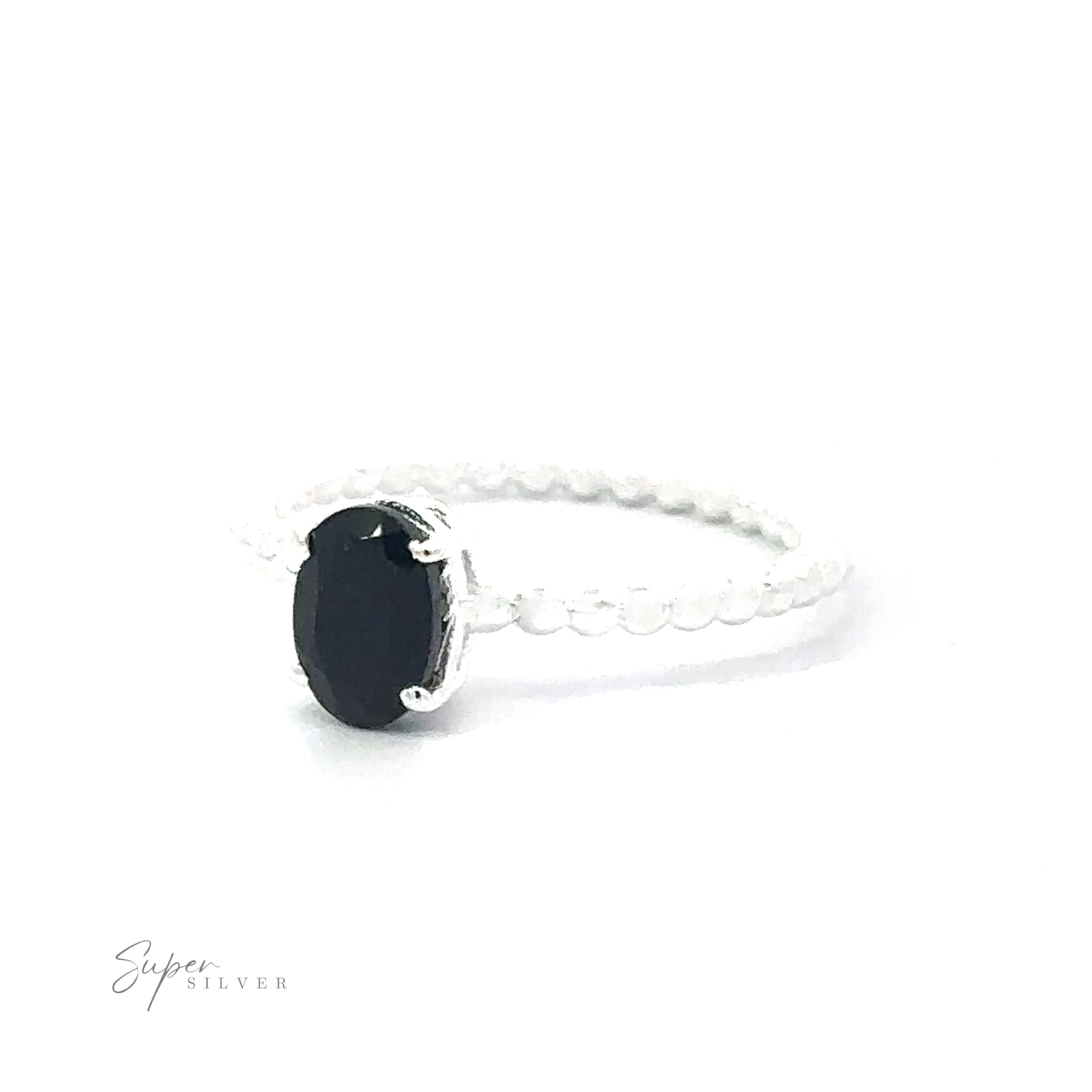 Stunning Oval Gemstone Ring with Beaded Band with an oval black stone set on a white background.