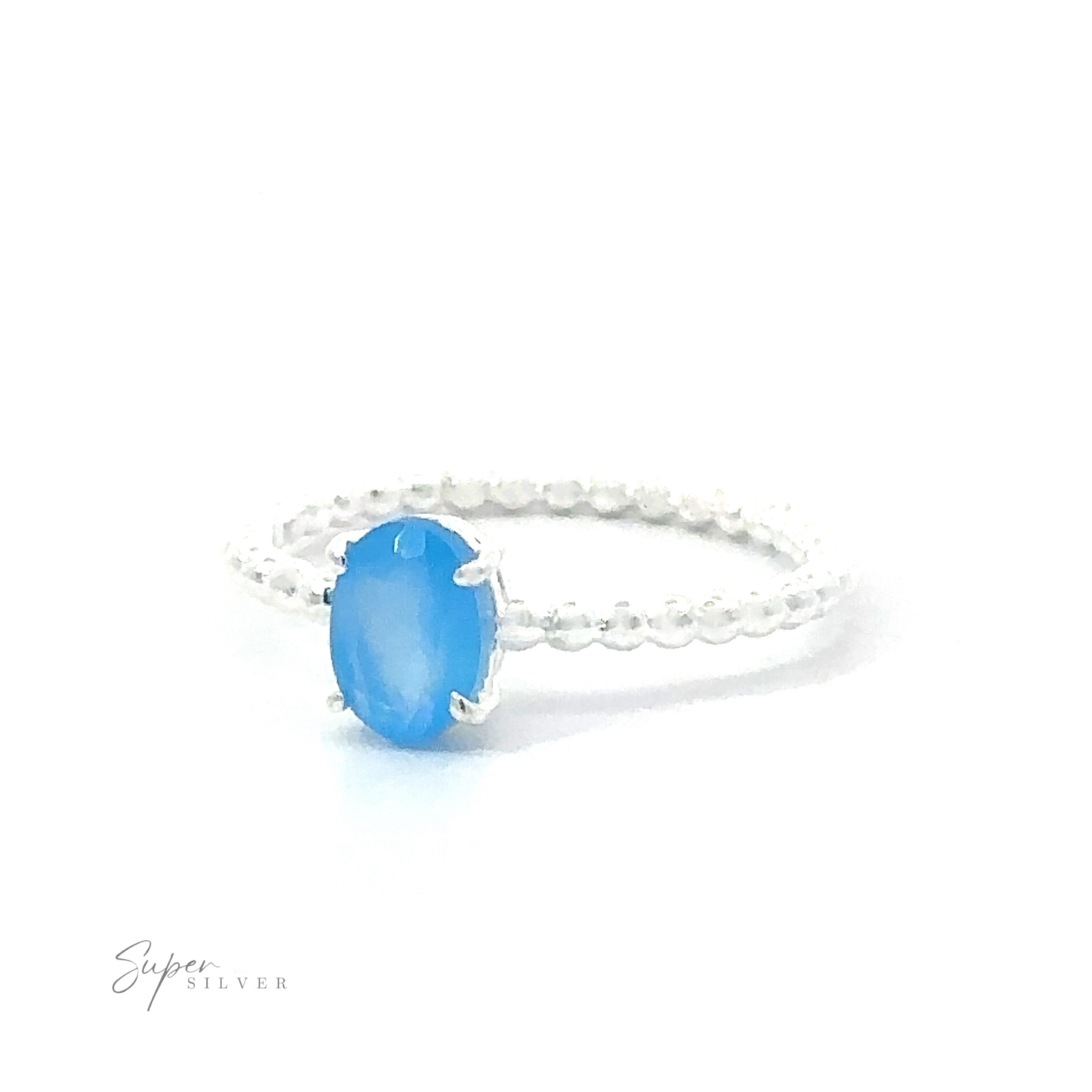 Stunning Sterling Silver Oval Gemstone ring with a beaded band, set on a white background.