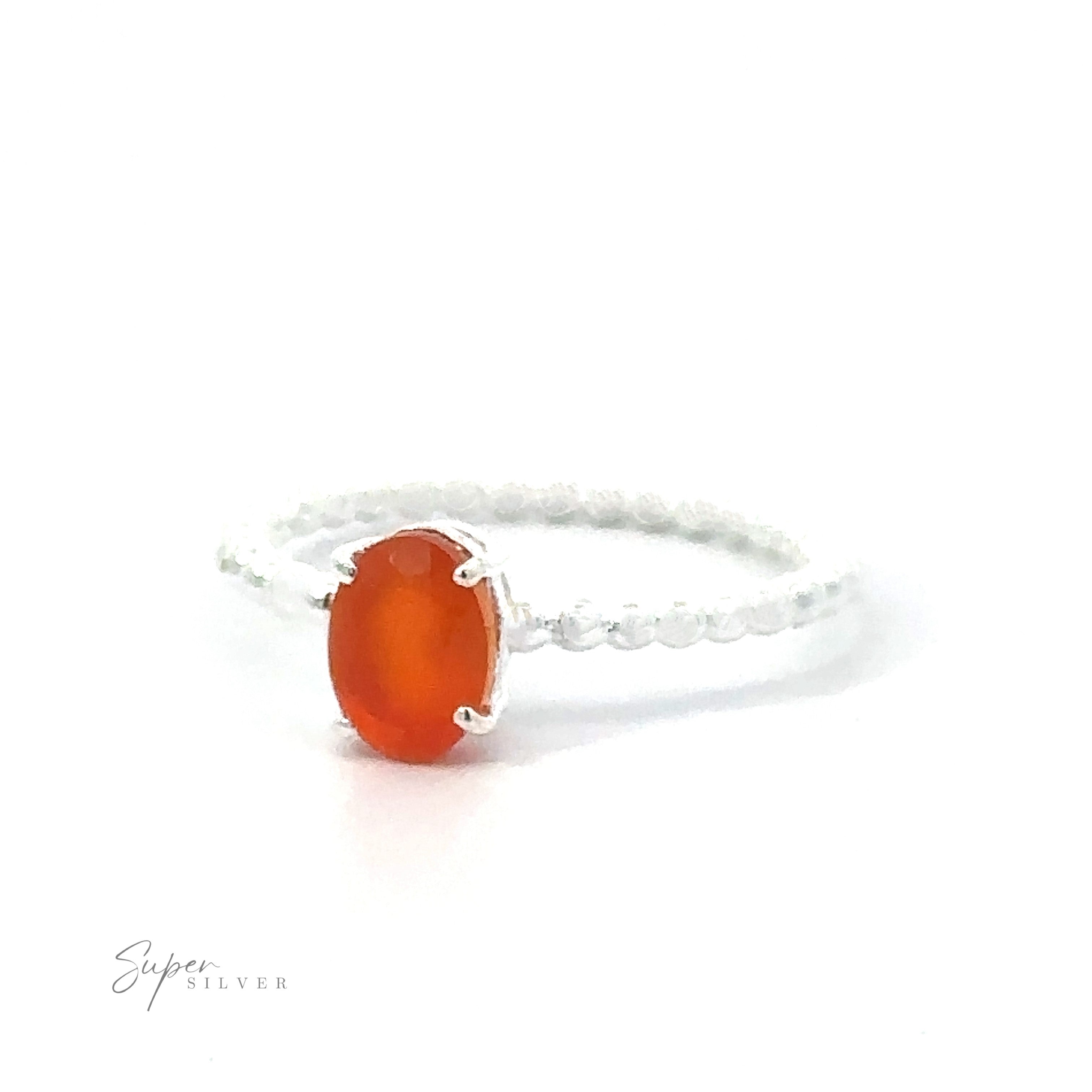 Stunning Oval Gemstone Ring with Beaded Band with a single orange stone set in a simple band.