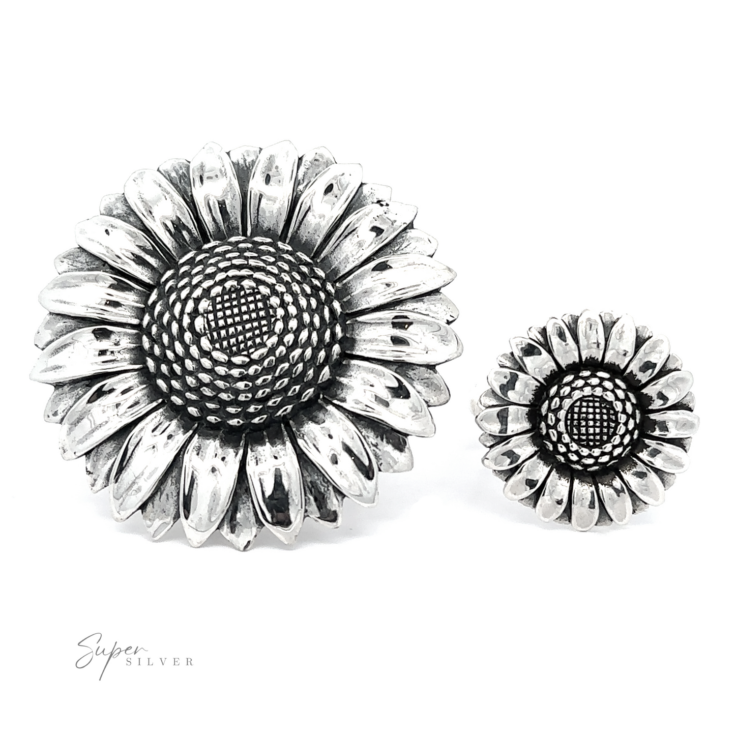 A pair of silver sunflower-shaped earrings of different sizes, showcasing floral elegance with detailed petal designs on a white background.