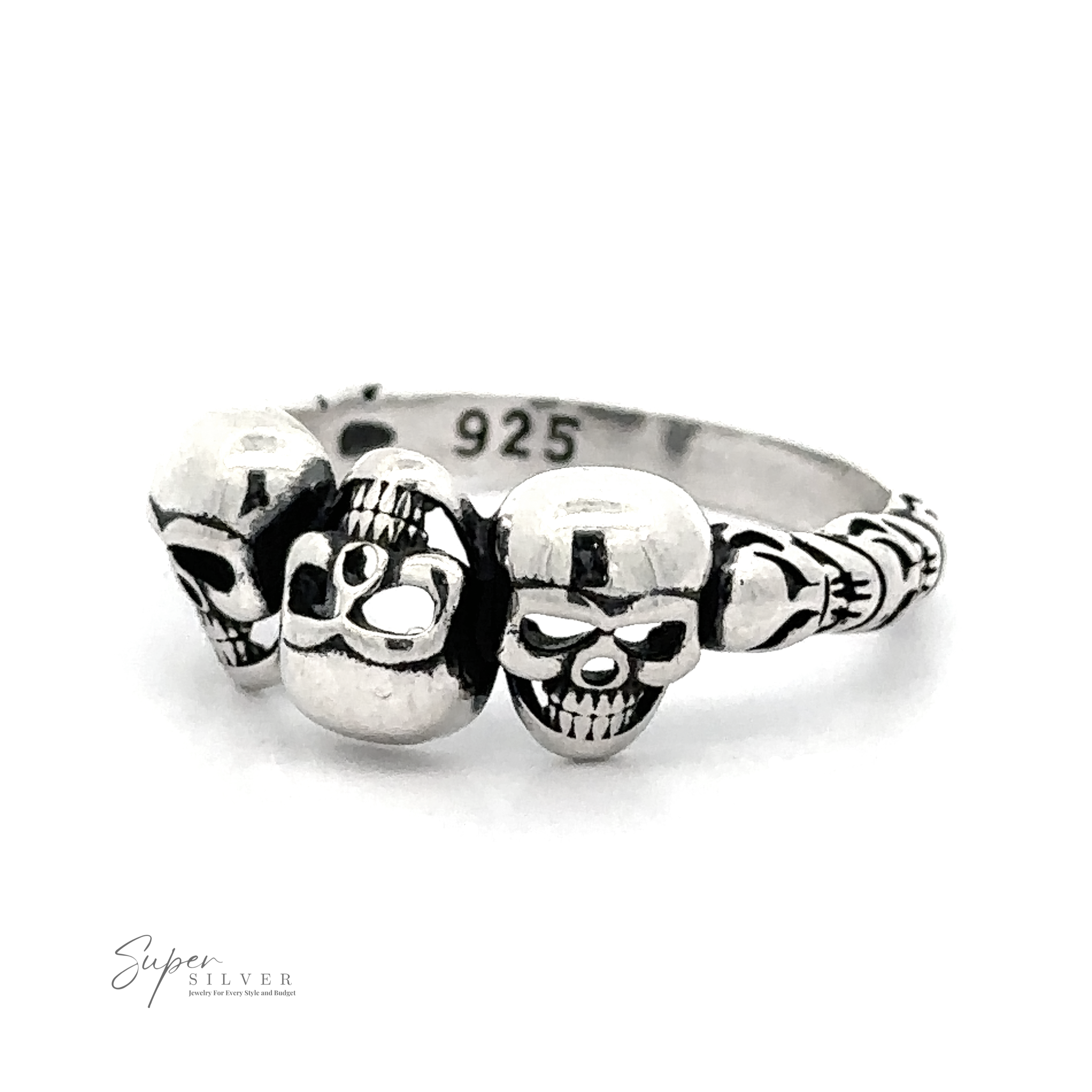 A Three Skulls Ring featuring three skull designs, with the hallmark ".925 Silver" indicating silver purity. The background is plain white.