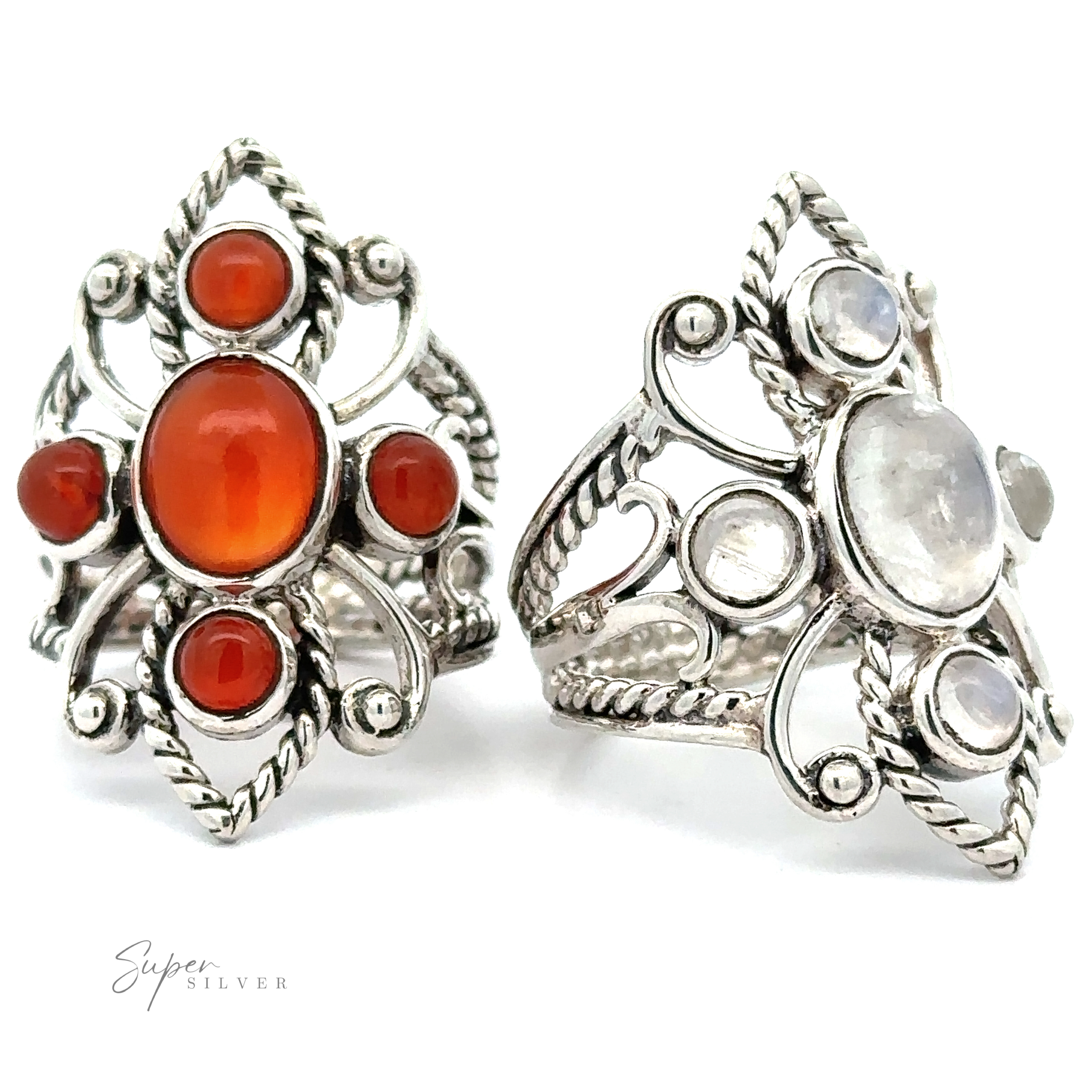 Two ornate sterling silver Online Only Exclusive Carnelian Rings with carnelian crystals on a white background.