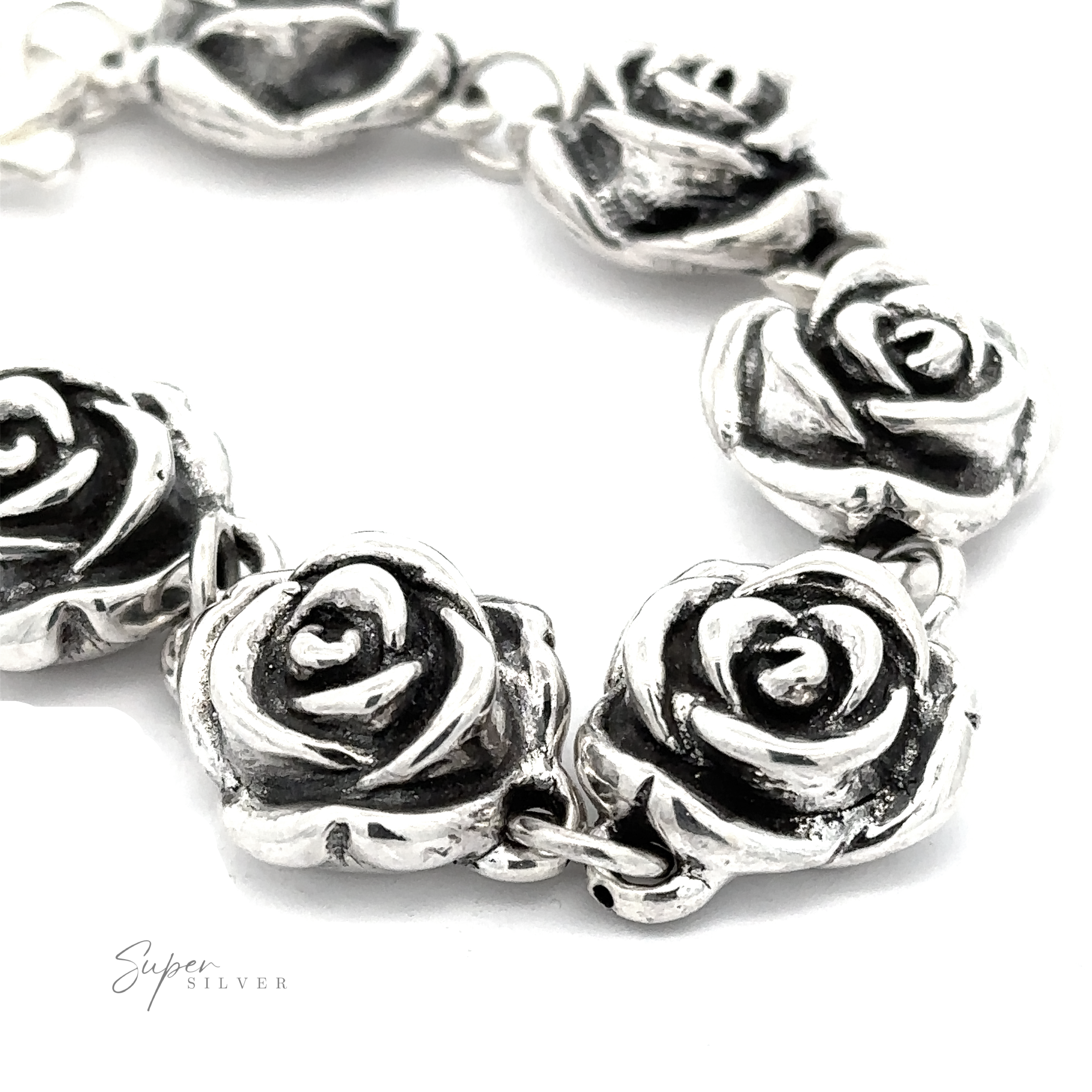 Close-up of a Chic Link Rose Bracelet featuring intricately shaped rose designs. The bracelet exudes a vintage vibe, emphasizing the detailed craftsmanship of the floral elements. Sign reads "Super Silver".