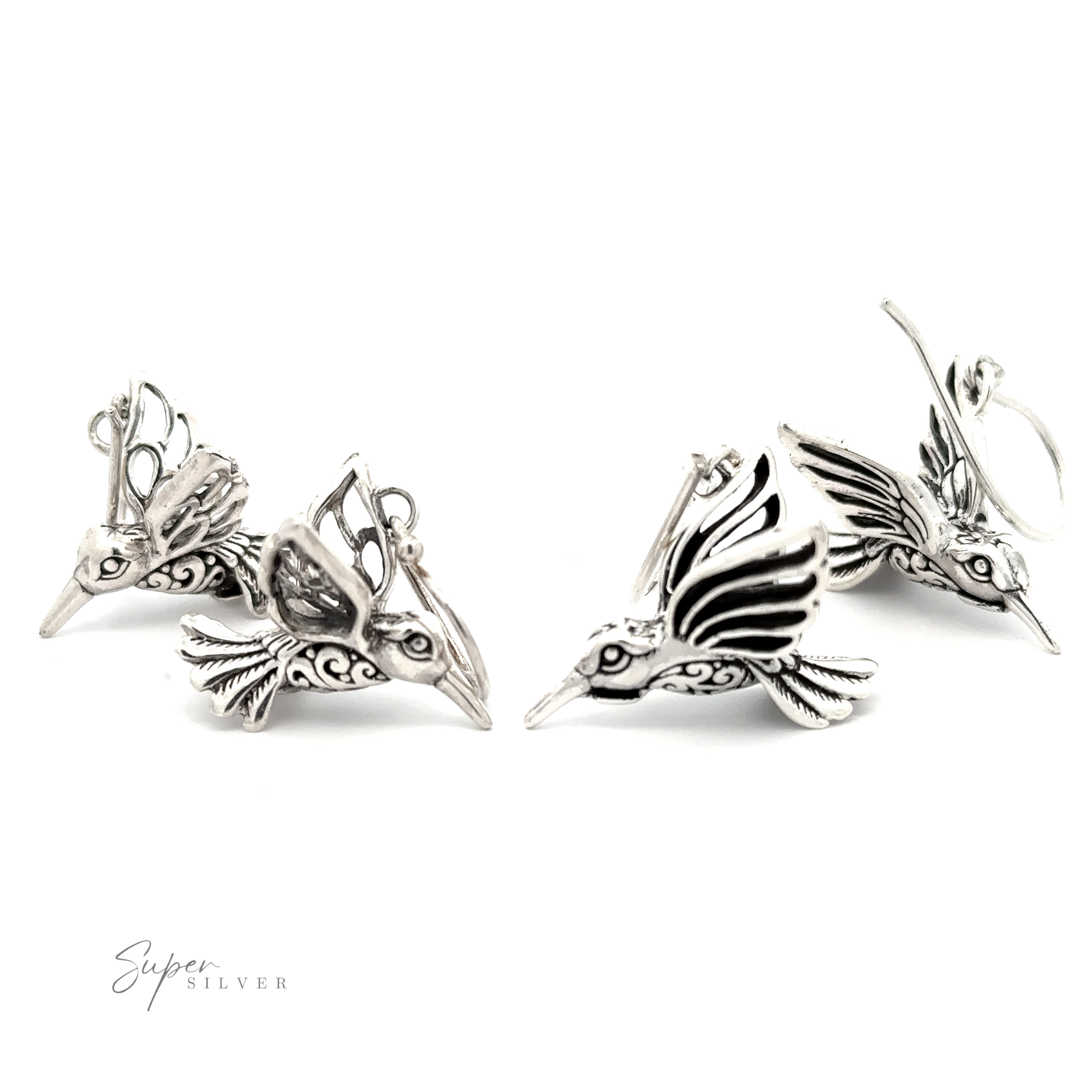 Four Filigree Hummingbird Earrings are arranged against a white background, featuring intricate filigree designs with wings spread. The brand name "Super Silver" is visible in the lower left corner.