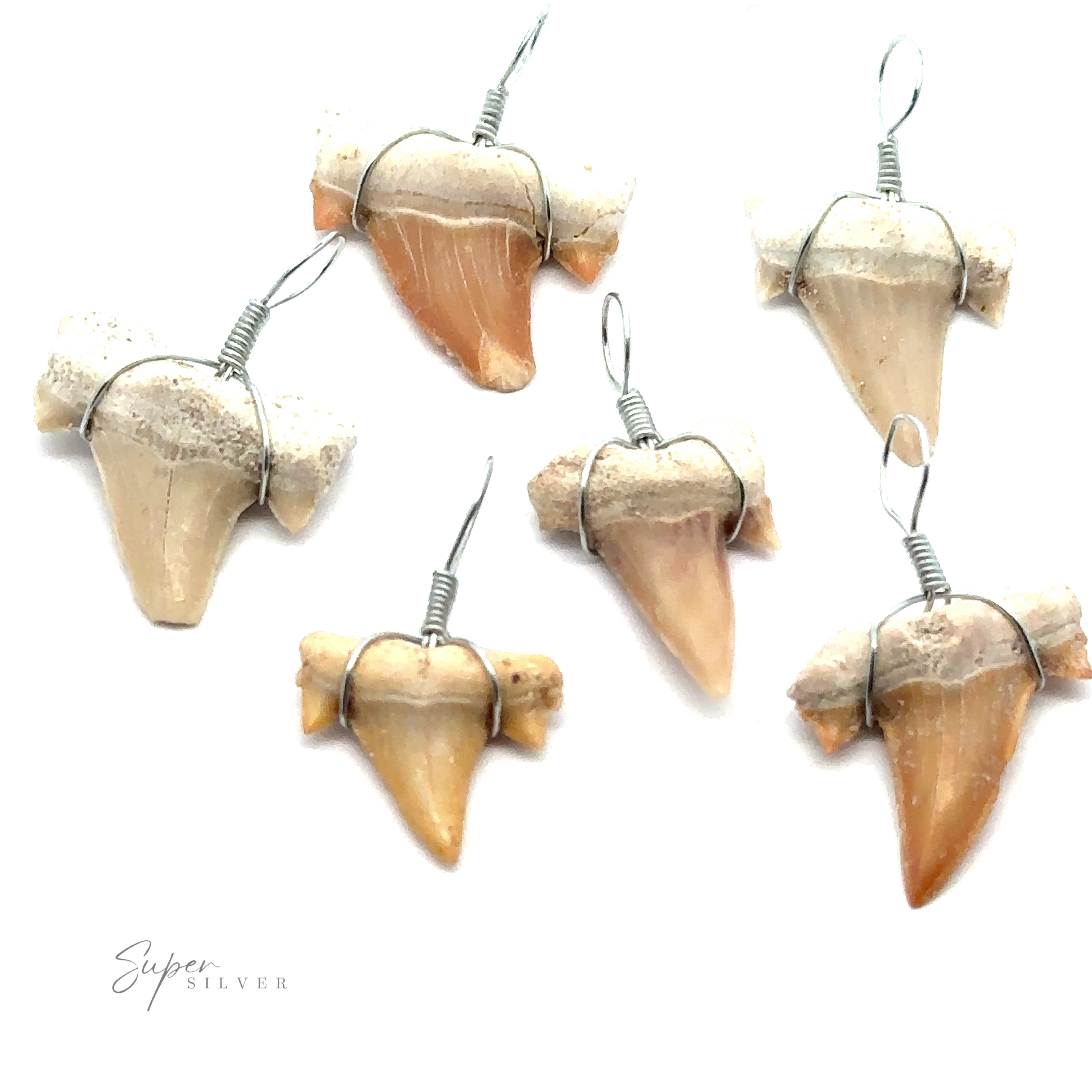 Six Sharks Tooth Wire Wrapped Pendants, crafted with mixed metal and featuring varying sizes and colors, are displayed against a white background. A "Super Silver" text graces the bottom left corner, highlighting the elegance of each Sharks Tooth Wire Wrapped Pendant.