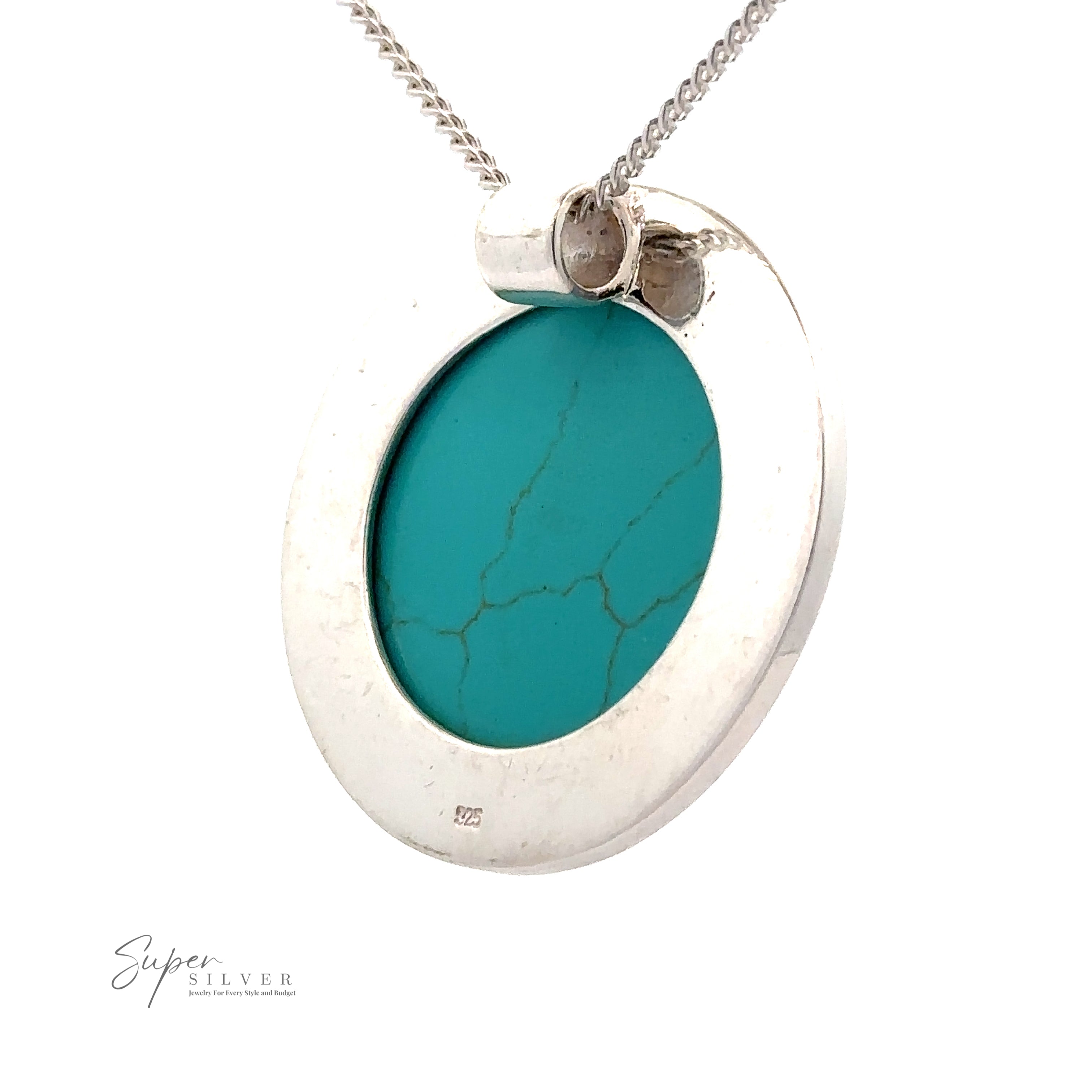 A minimalist silver necklace featuring a Large Round Turquoise Pendant on a thin chain. The pendant has a polished silver frame.