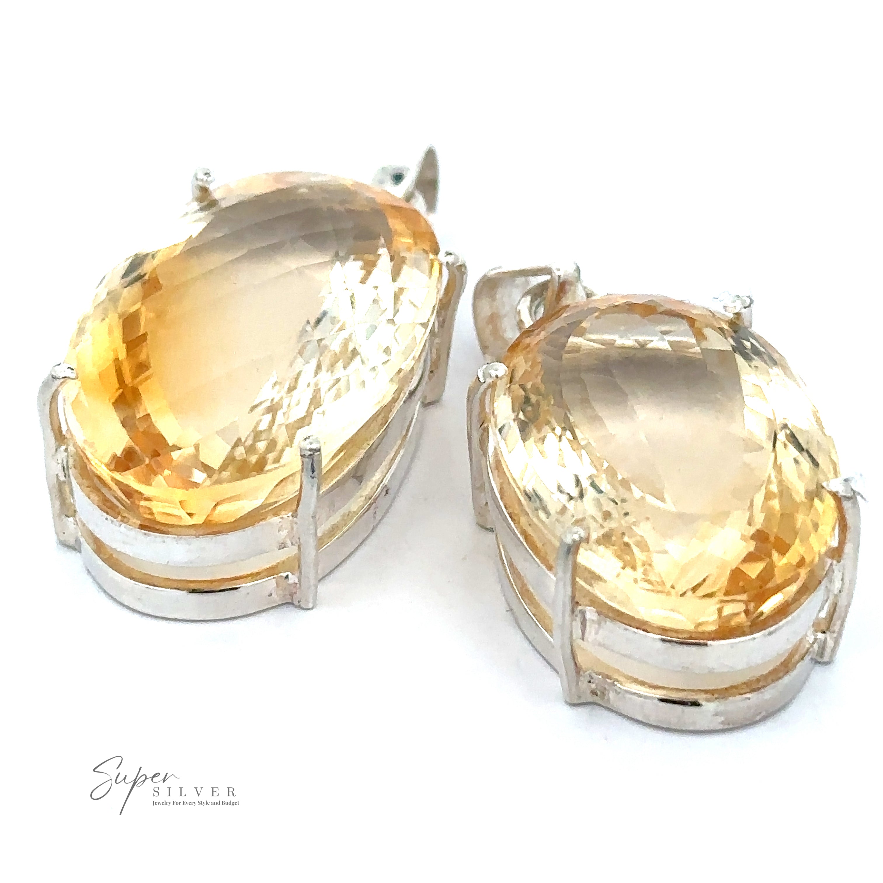 A Brilliant Pronged Citrine Pendant featuring large, faceted citrine gemstones set in sterling silver prongs, with the logo "Super Silver" visible in the lower left corner.