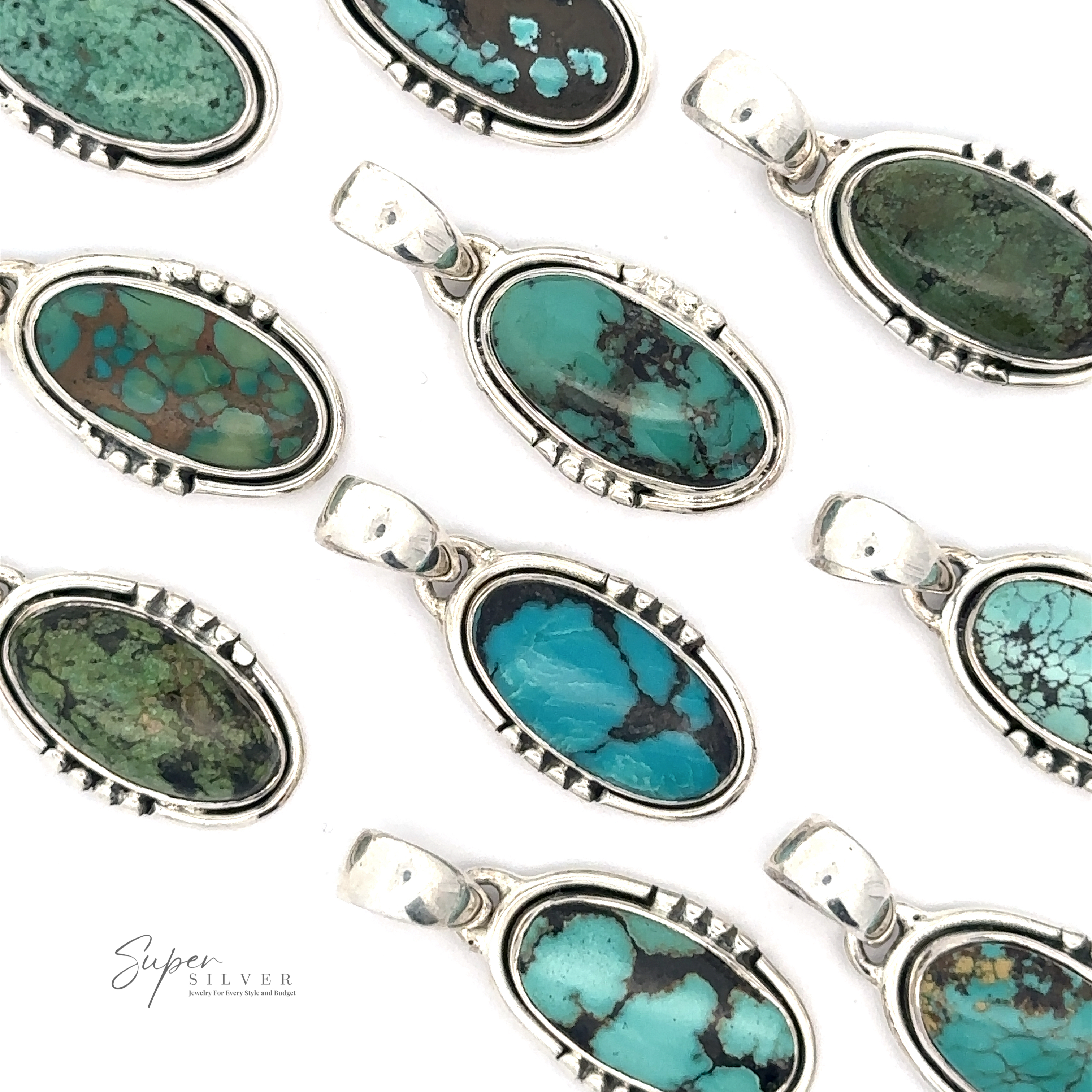 A collection of Natural Turquoise Elongated Oval Pendants set in handmade .925 sterling silver, arranged in neat rows on a white background. Each pendant showcases different patterns and shades of natural turquoise.