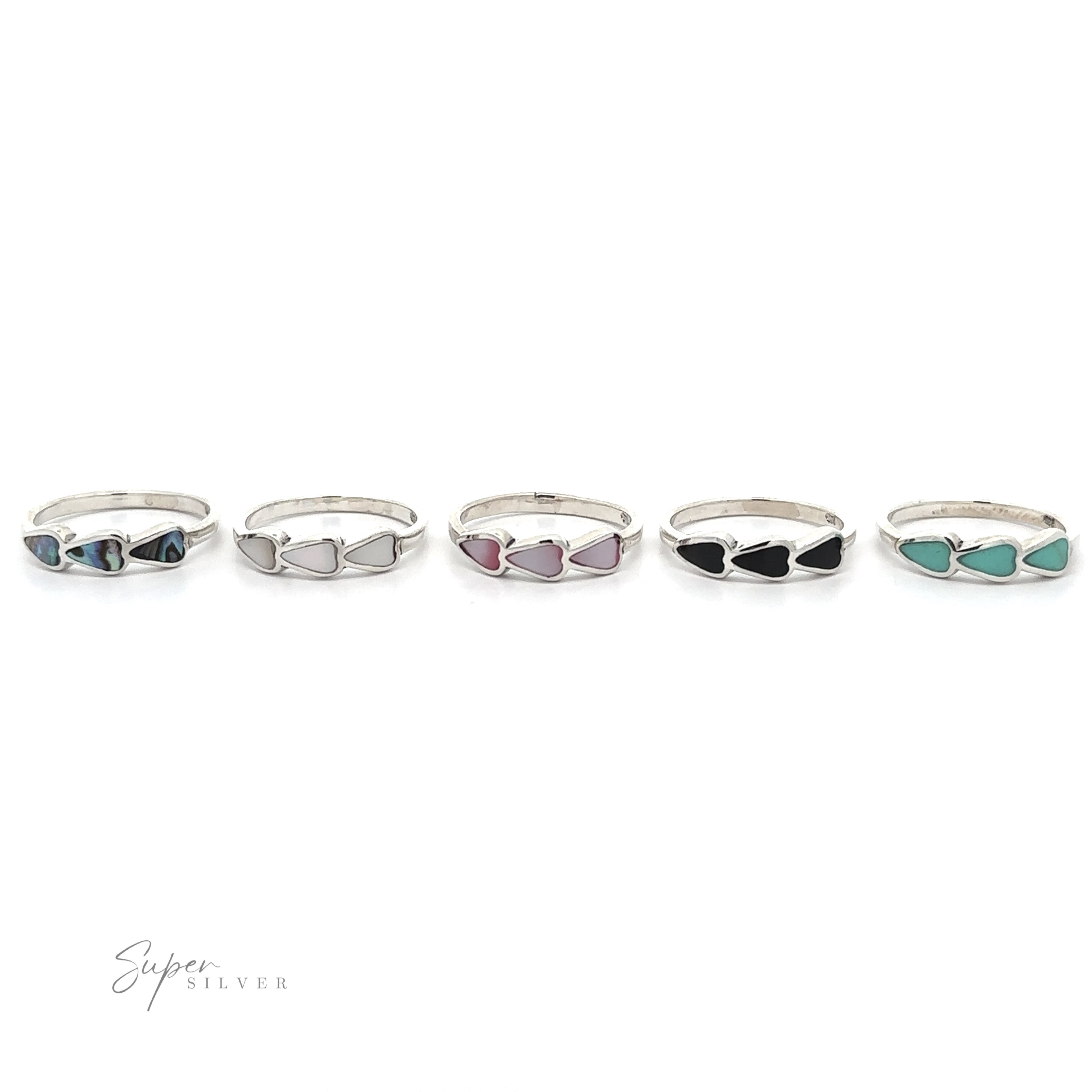 A set of five Triple Heart Rings with Inlaid Stones in different colors.