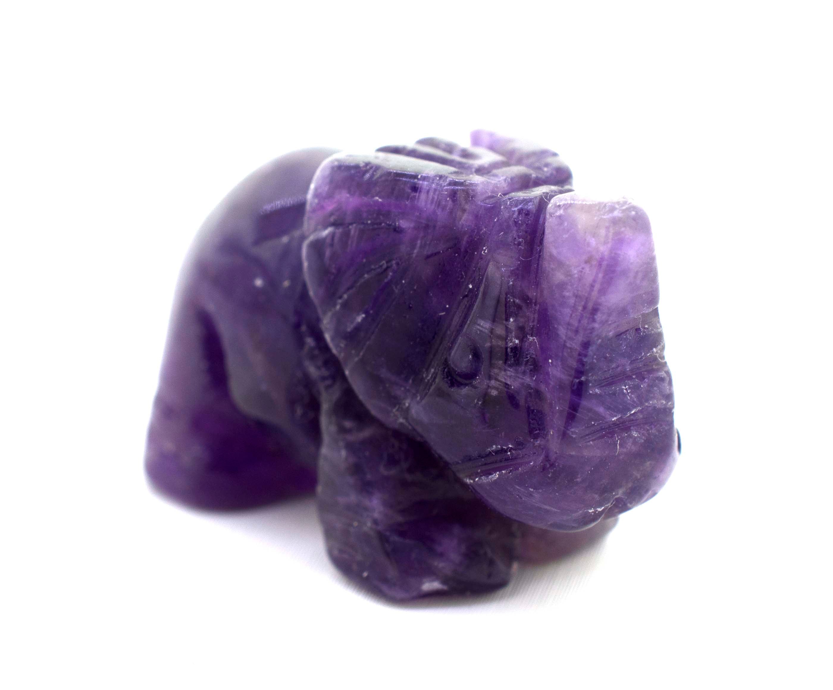 An Elephant Carved Gemstone Figures on a white background, showcasing the beautiful crystal.