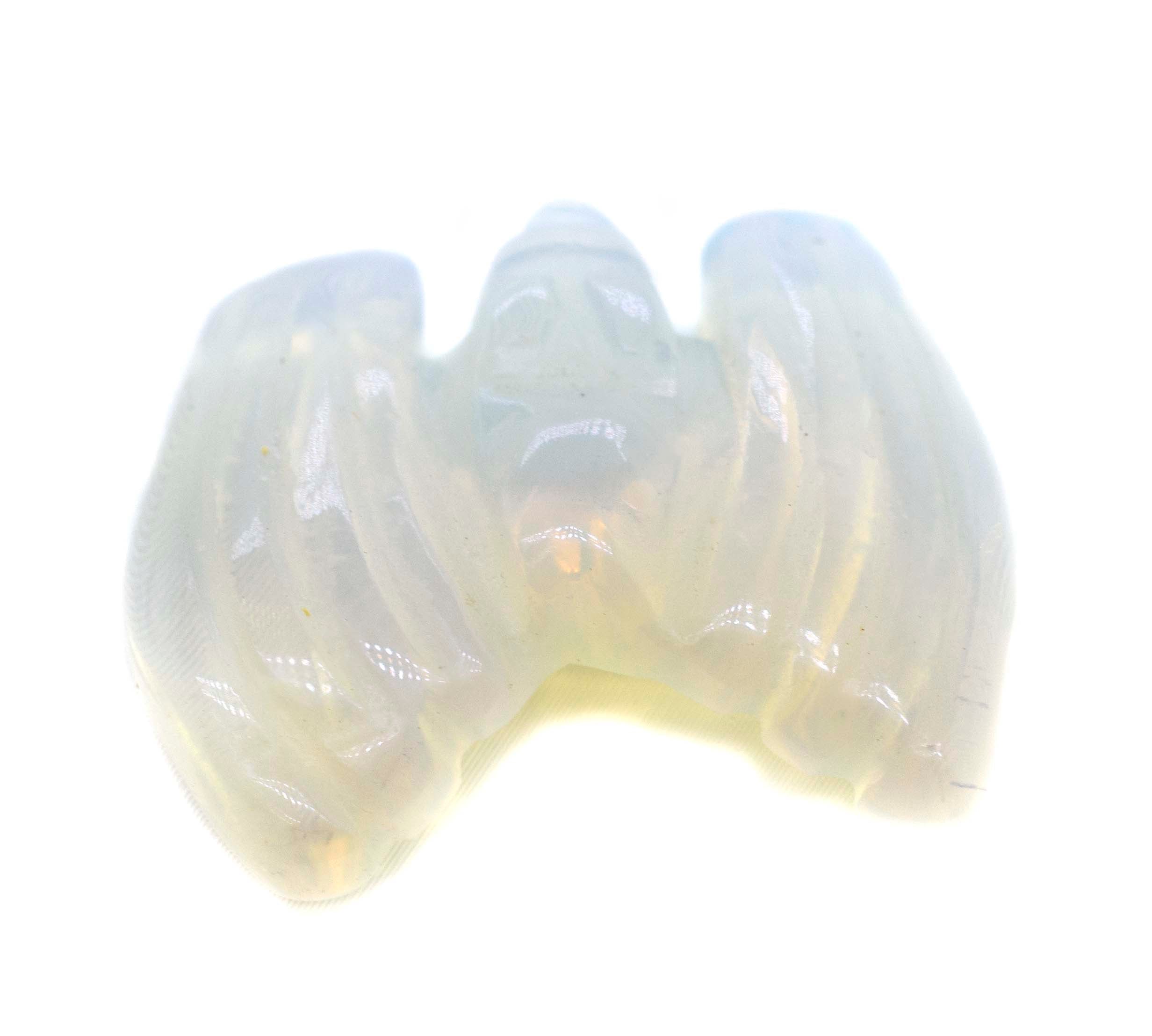 A Bat Gemstone Figure shaped crystal on a white background, perfect as a decorative accessory or for those who love rose quartz.