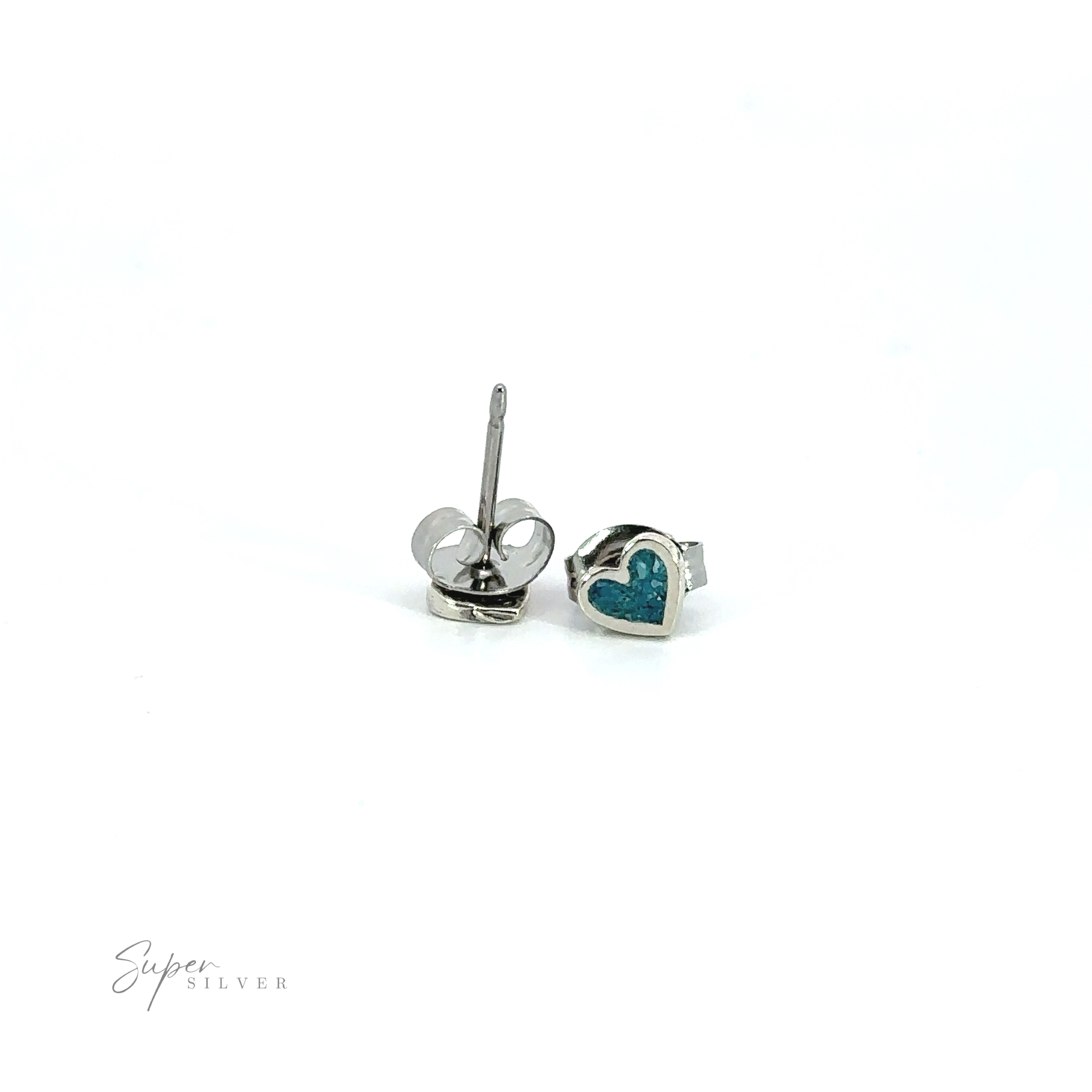 A pair of Tiny Turquoise Heart Studs with inlaid turquoise stones.