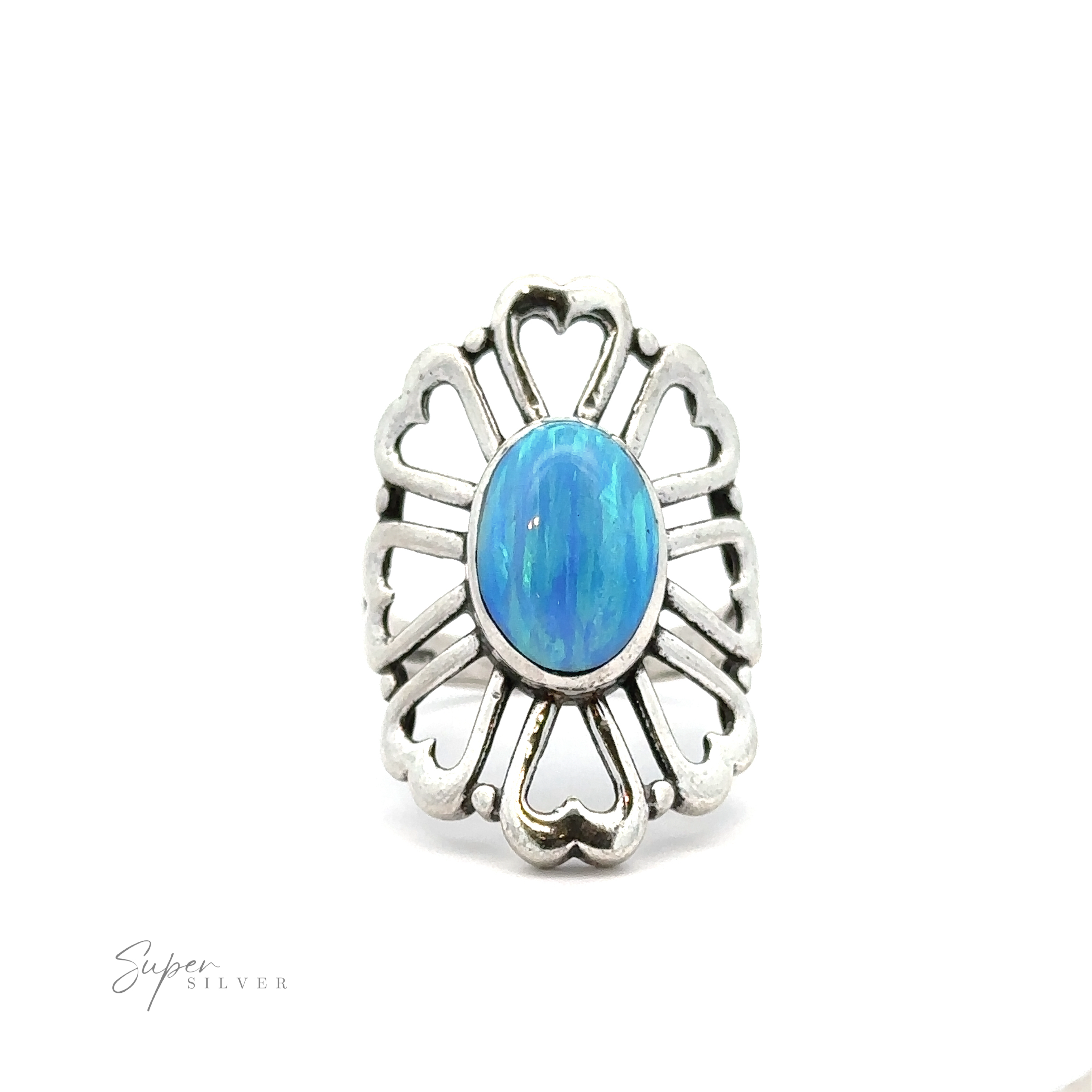 An American Made Opal Flower Ring with Heart Shaped Petals, encircled by heart-shaped motifs and radiating lines, is displayed against a white background. Handcrafted in America, the lower left corner bears the text "Super Silver.