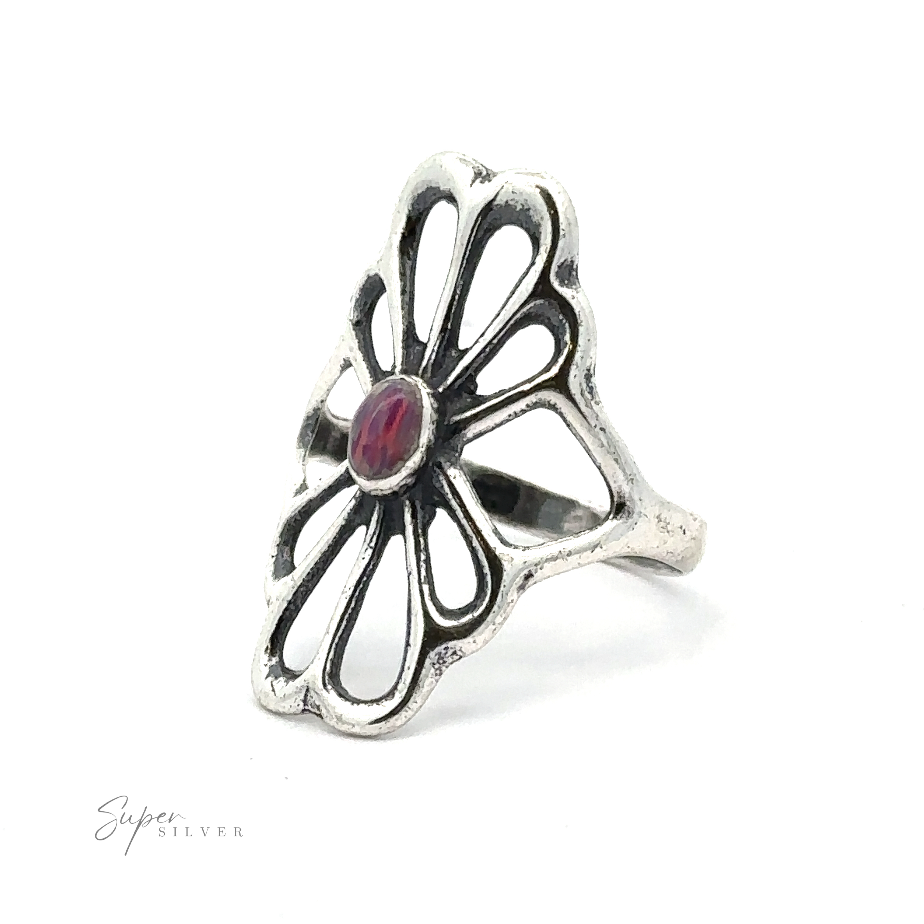 American Made Flower Ring with an openwork, sterling silver flower design featuring a central red gemstone. Handcrafted in America, this exquisite piece stands out with its intricate detailing. "Super Silver" text is visible at the bottom left corner.