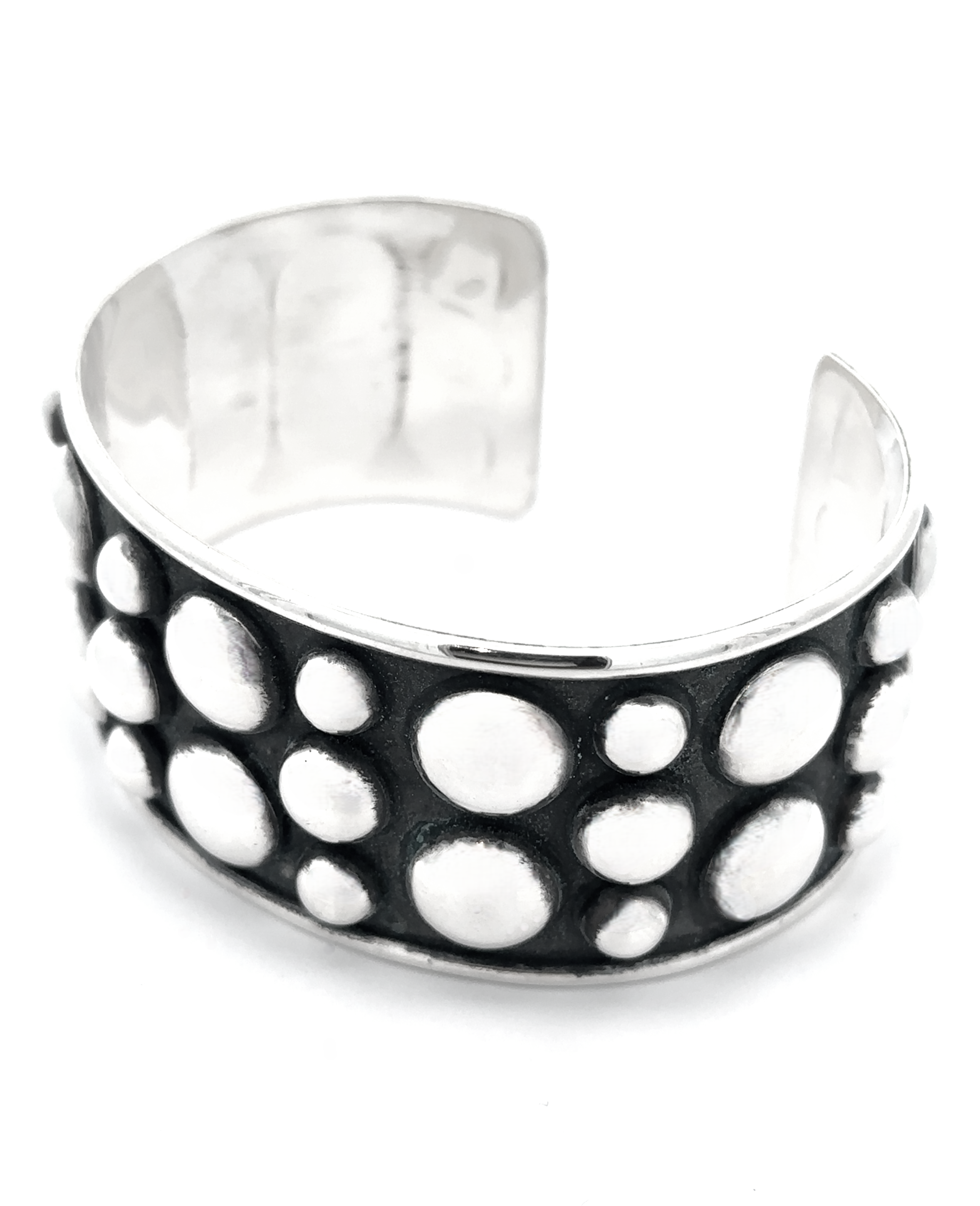 Unique Ball Studded Cuff with a striking design of raised circular dots on a dark background, emanating a rebellious vibe.
