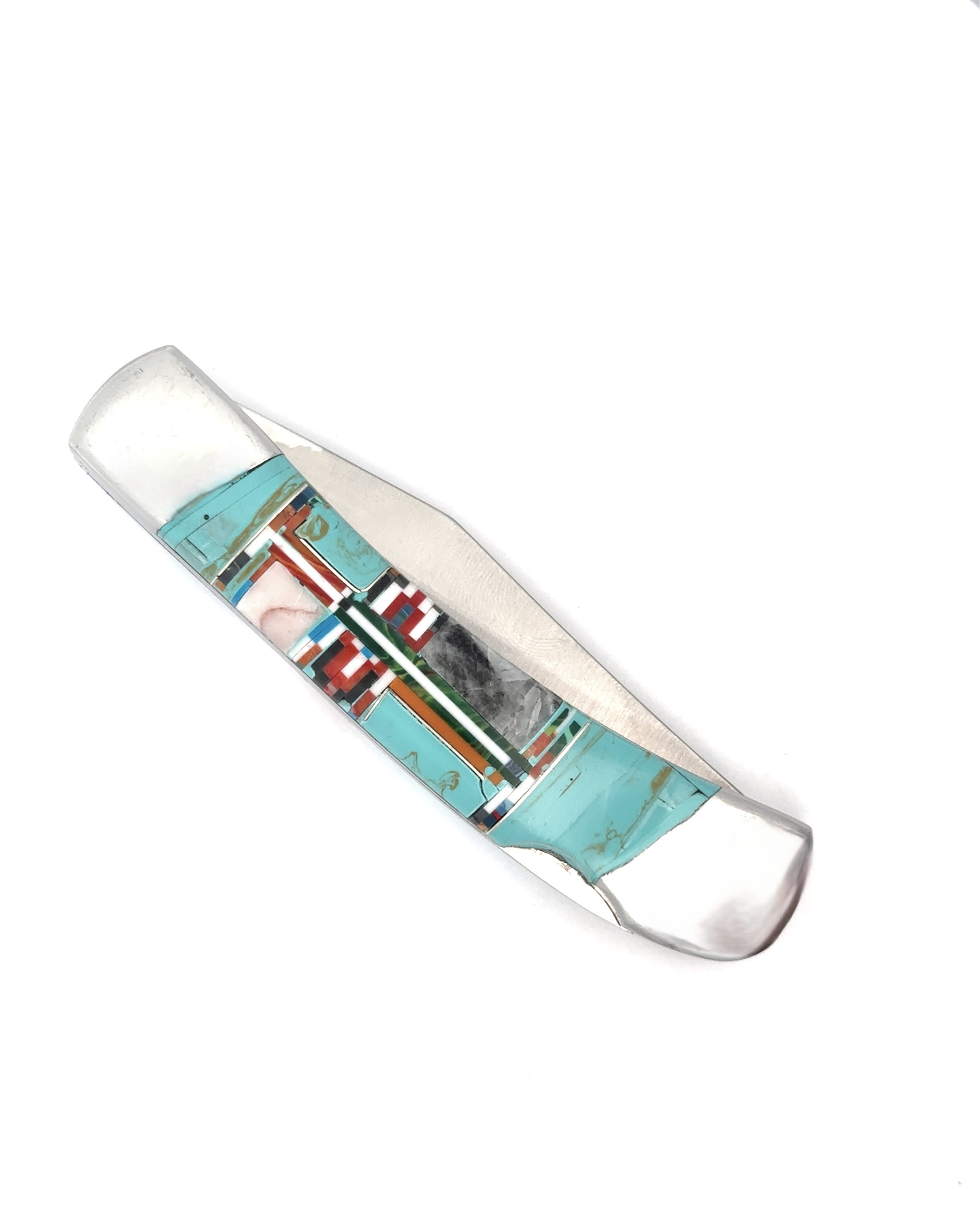 Introducing the Intricate Inlay Southwest Pocket Knife, adorned with striking geometric patterns featuring turquoise inlay, coral, and black elements.