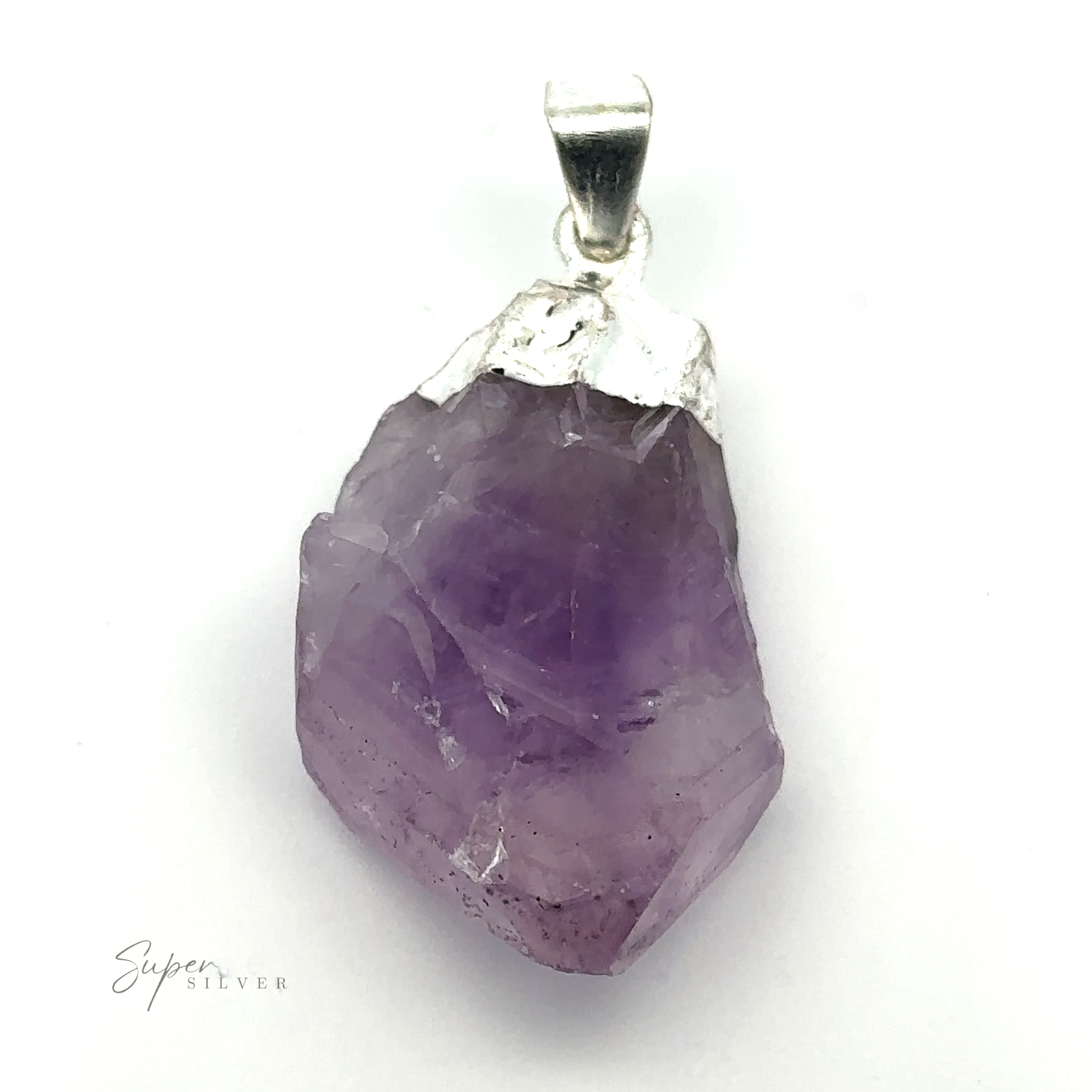 A rough, purple amethyst crystal pendant with a silver bail, displayed on a white background. The text "Raw Crystal Pendant With Silver Cap" is visible at the bottom left. This natural gemstone pendant showcases the beauty of raw crystals in their purest form.