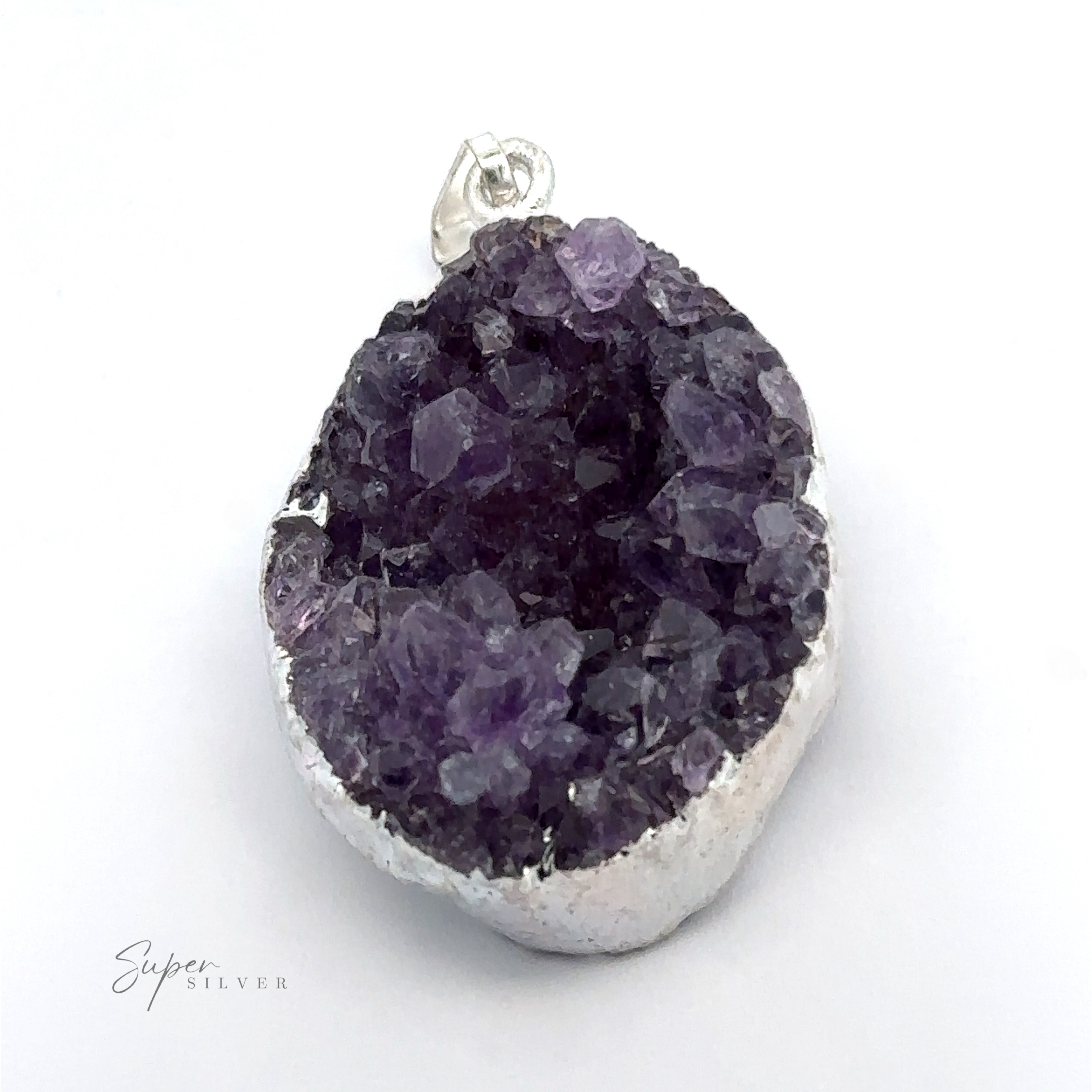 A stunning Amethyst Geode Pendant with a silver-plated casing and a small loop for a chain, its edge rimmed with silver to enhance its natural beauty. Perfect for those who appreciate the unique allure of mixed metals.