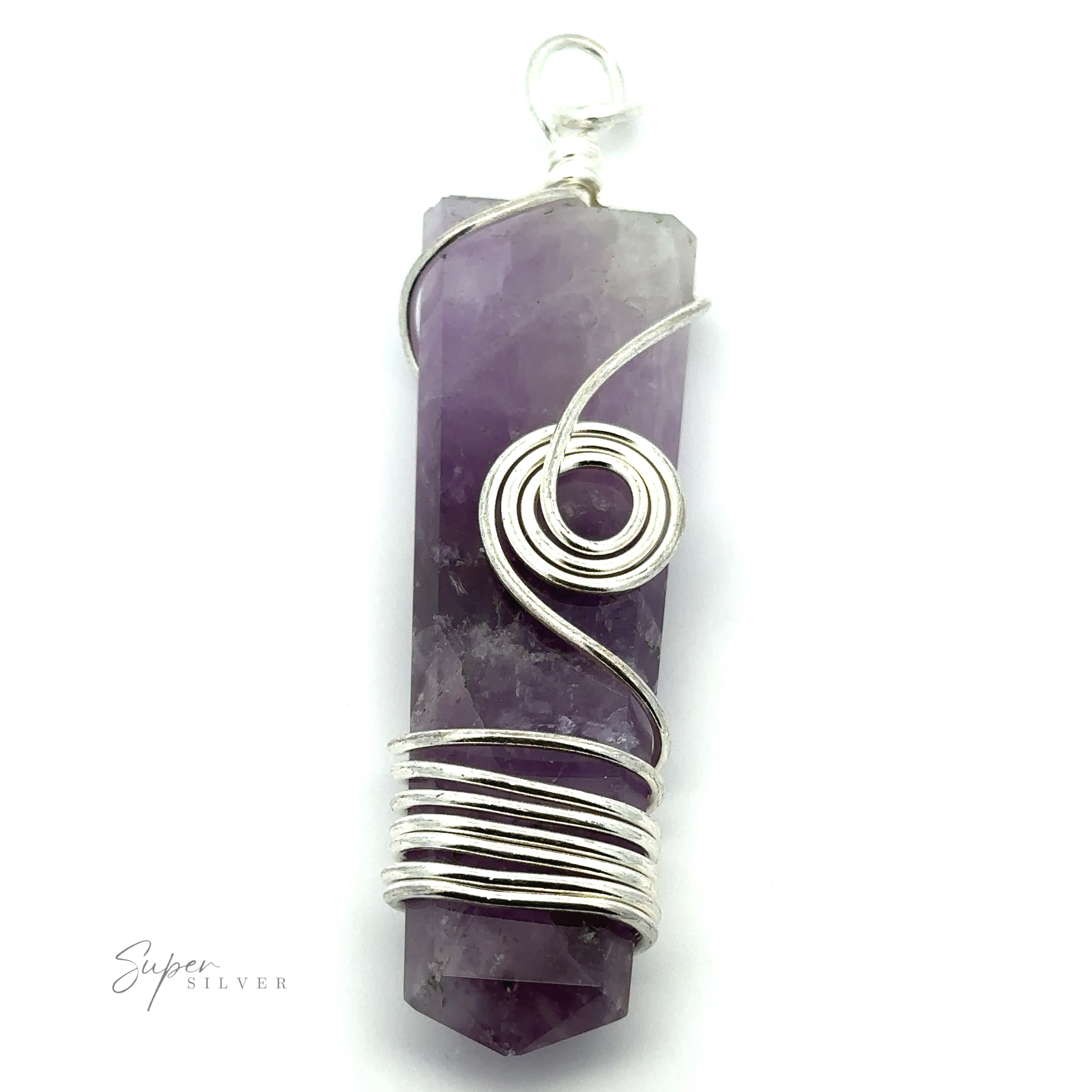 A Stone Slab Pendant with Wire Wrapping featuring a purple crystal wrapped in silver wire. The coiled wire forms decorative loops around the middle and top of the hexagonally faceted crystal, which has pointed ends. This piece exemplifies wire wrapped jewelry with its intricate mixed metals design.