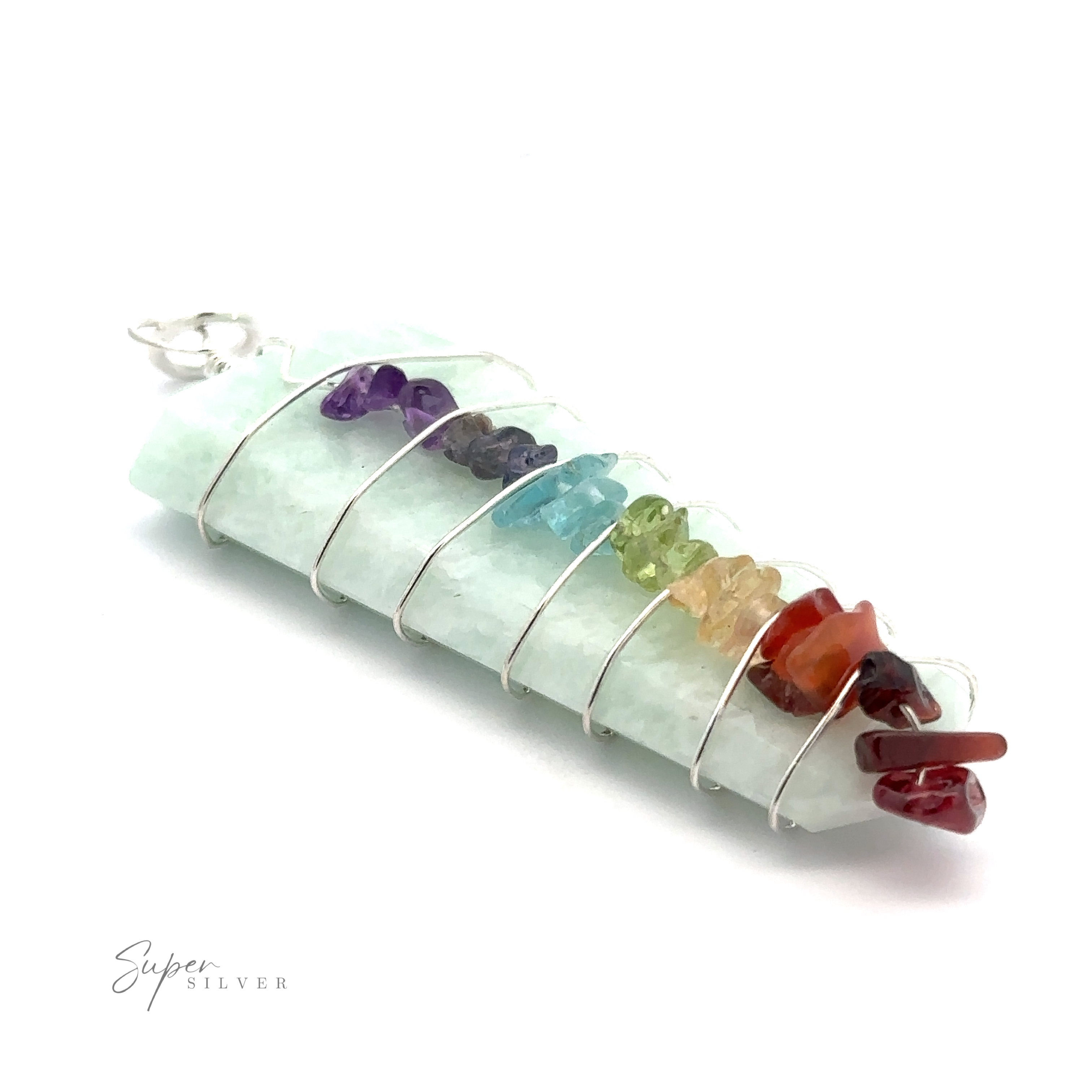 A Stone Slab Wire-Wrapped Chakra Pendant featuring seven colorful chakra stones, laid out on a white background.