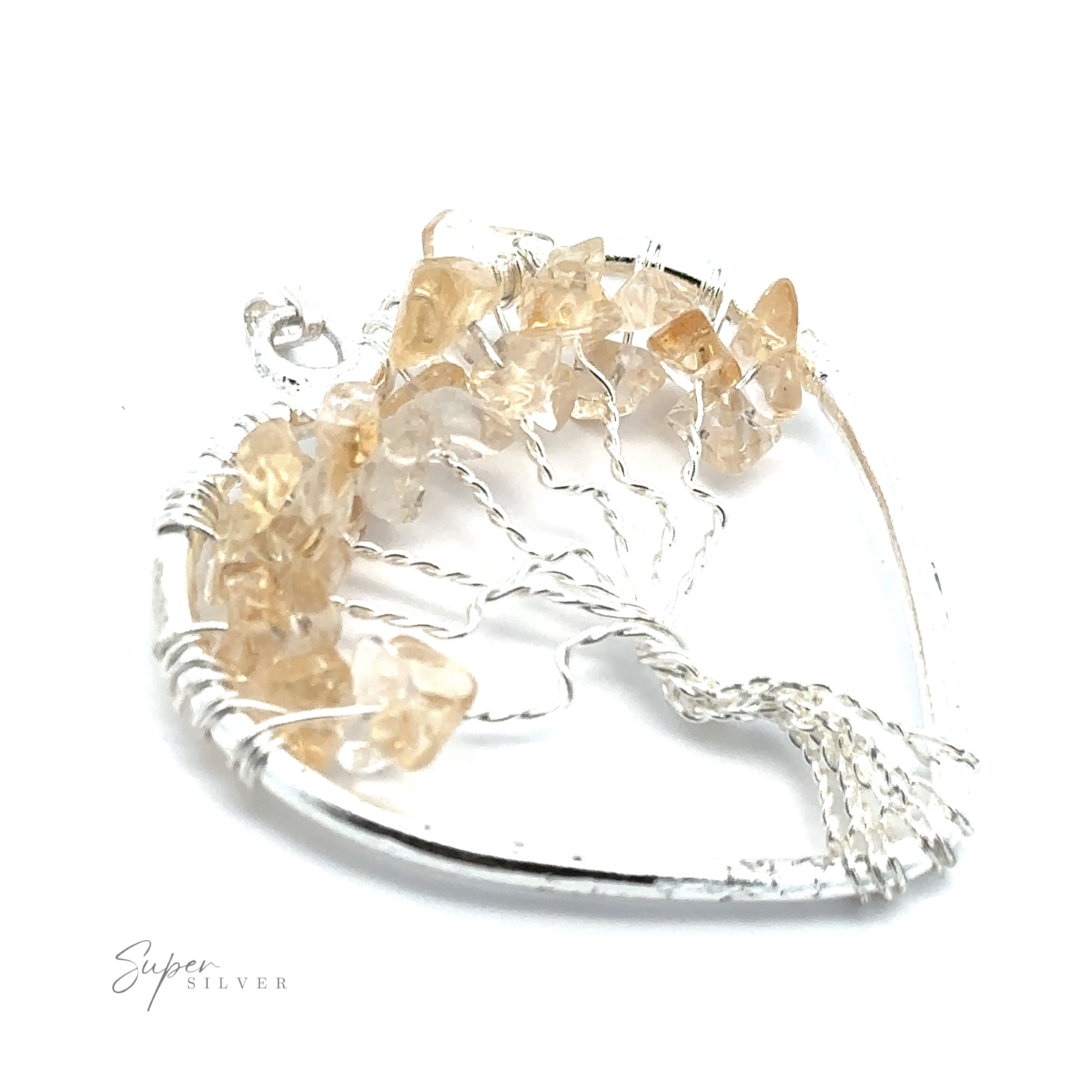 A Heart Shaped Tree of Life Pendant crafted in silver, with light brown gemstone chips resembling leaves. The signature "Super Silver" is visible at the bottom left of the image.