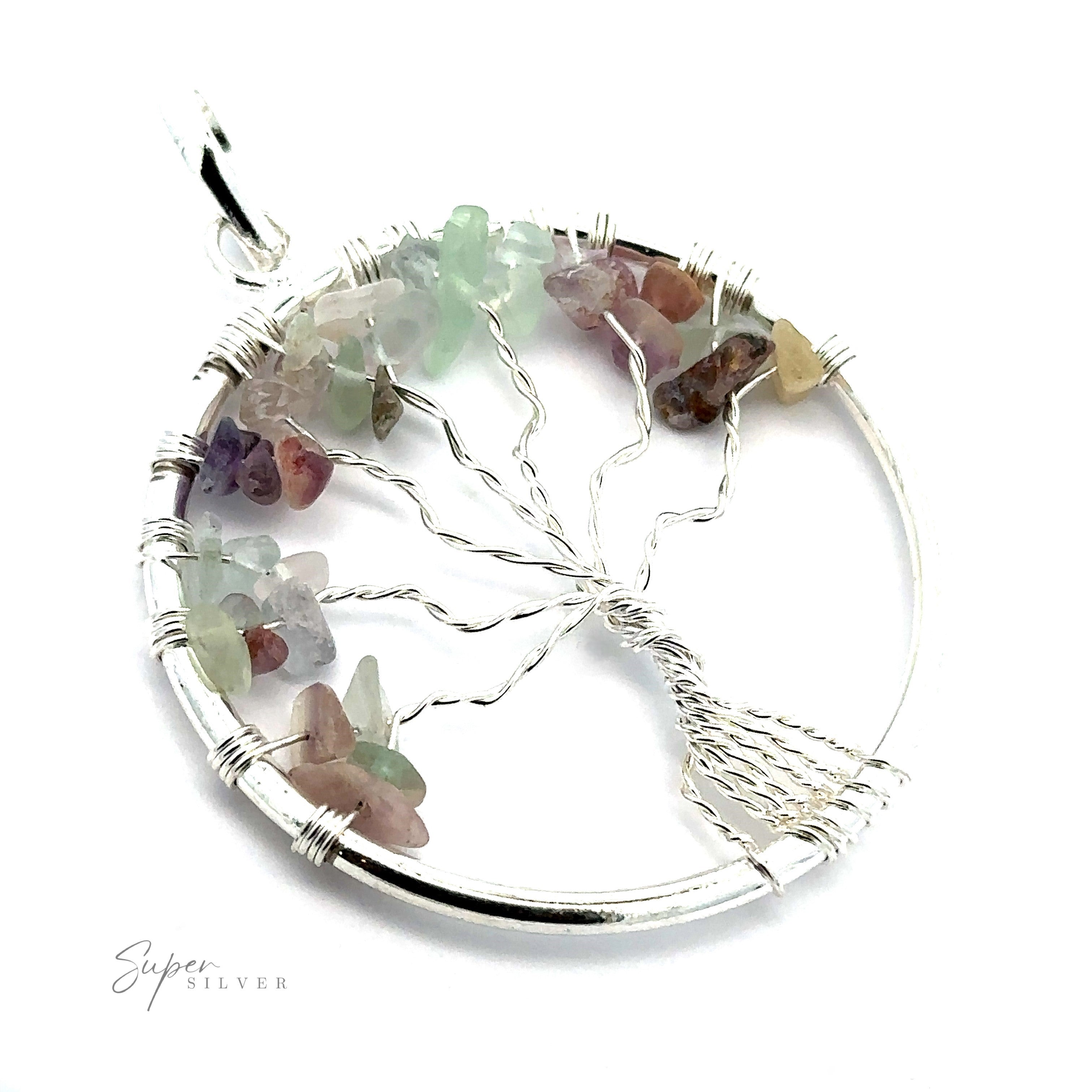 A Wire Wrapped Tree of Life Pendant with Stones, adorned with assorted small gemstones in shades of green, pink, and purple. The tree's branches and roots are intricately wire wrapped in silver.