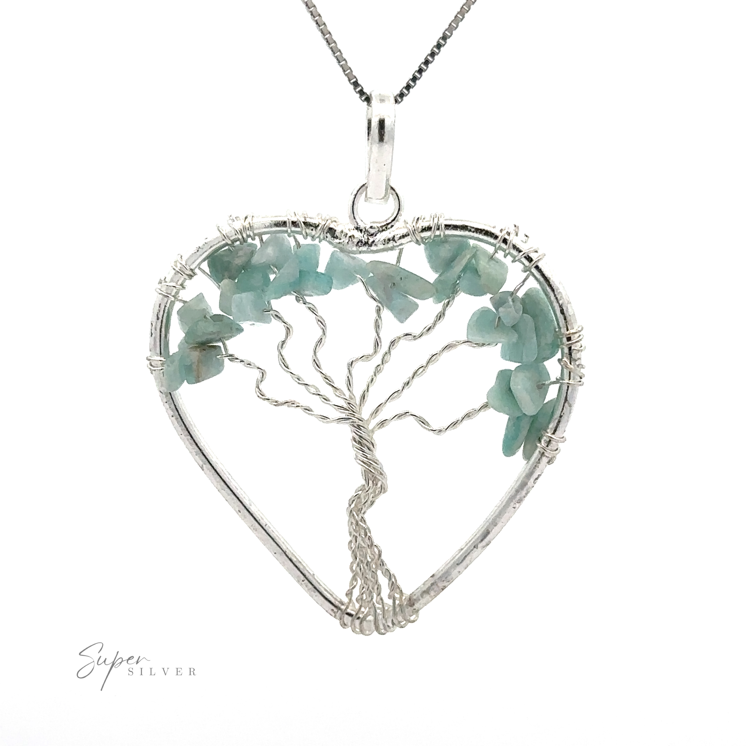 A Heart Shaped Tree of Life Pendant featuring a wire-wrapped tree of life design, adorned with light green raw stone beads, elegantly suspended on a silver chain.