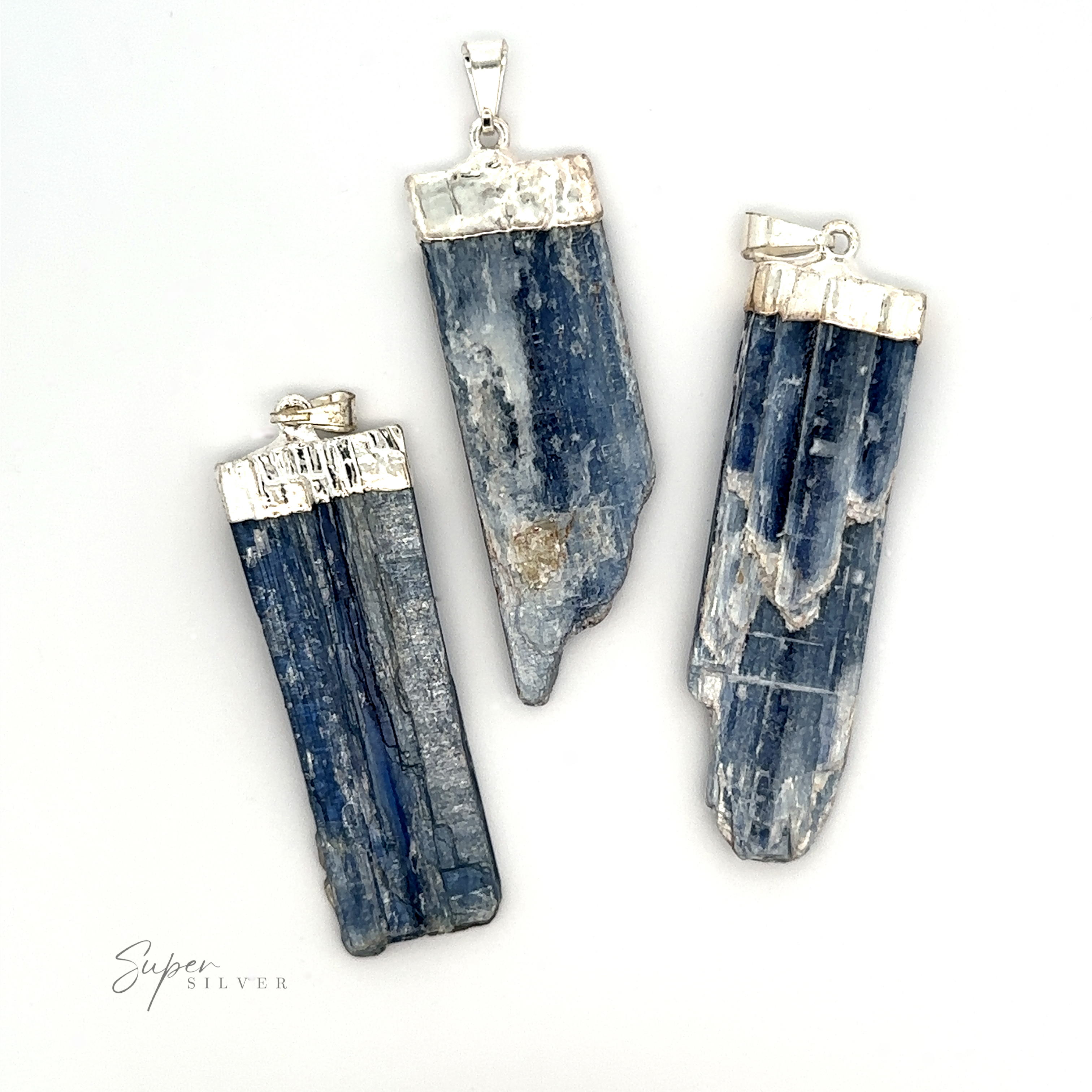 Three blue kyanite Raw Crystal Pendants With Silver Cap arranged on a white background. Text "Super Silver" in the bottom left corner, showcasing these stunning Natural Gemstone pendants.