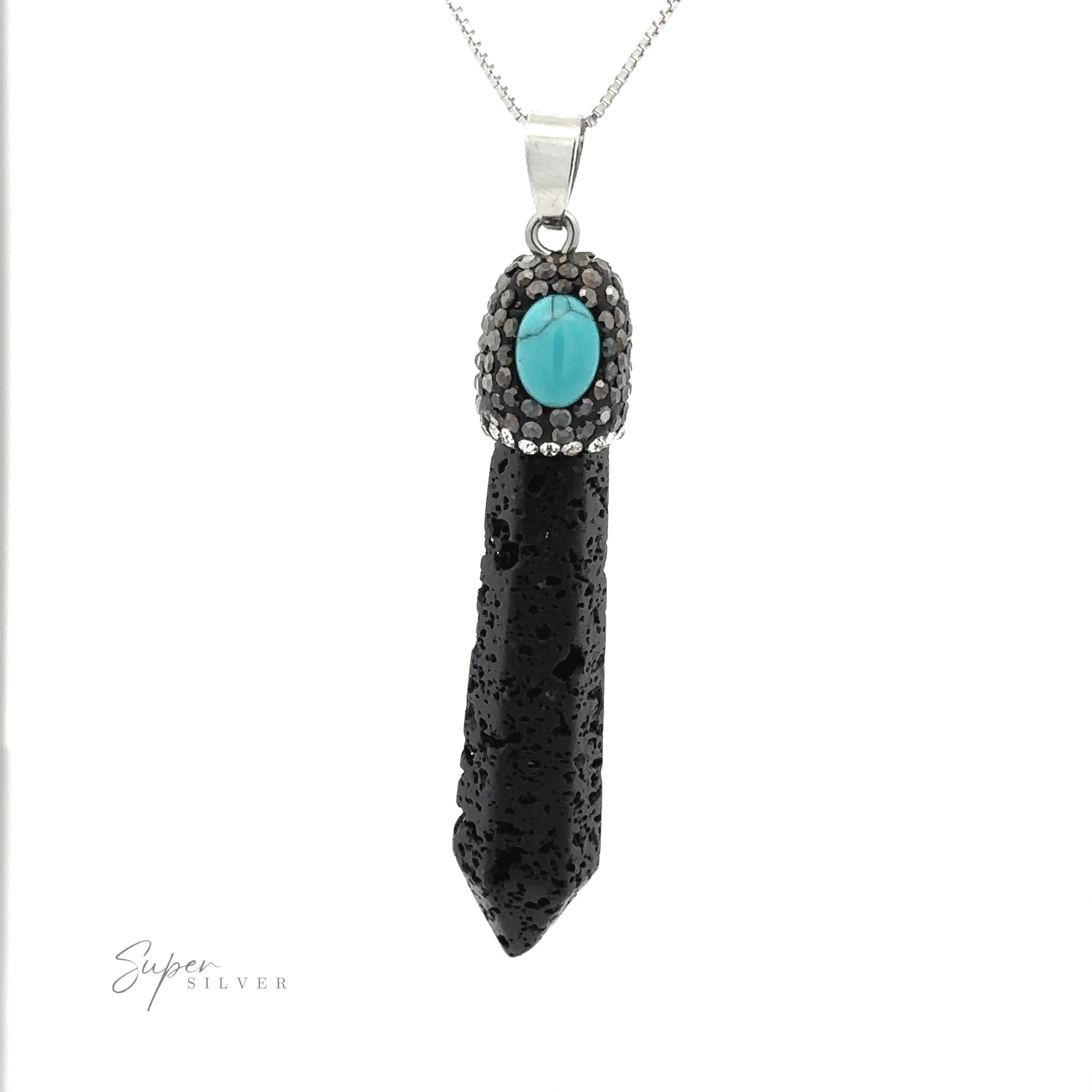 A black textured pendant with a turquoise stone at the top, reminiscent of a Stone Obelisk Pendant, set in a silver mount, hangs from a silver chain.