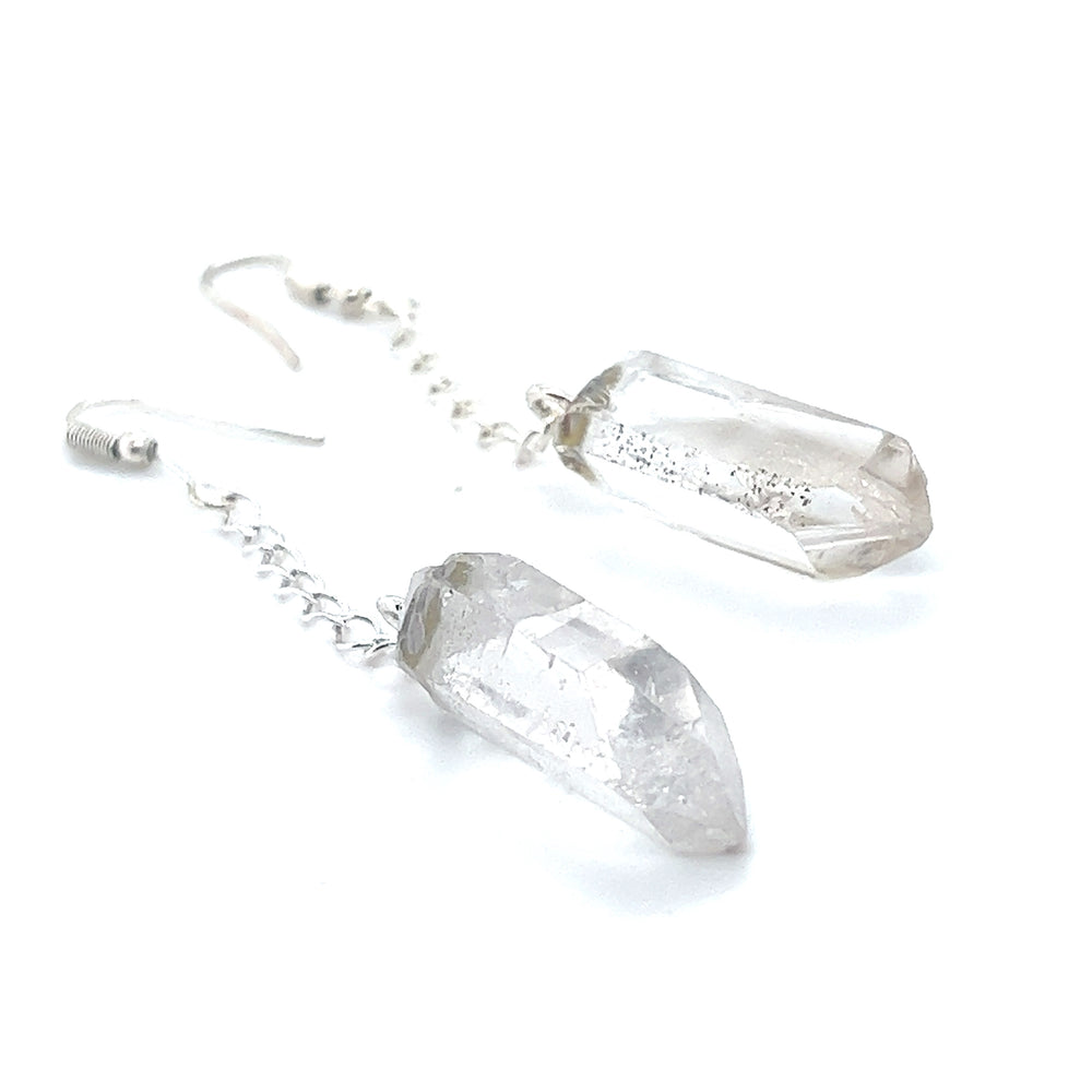 
                  
                    A pair of Super Silver Long Crystal Earrings With Chain on a white background for the bohemian earth lover.
                  
                