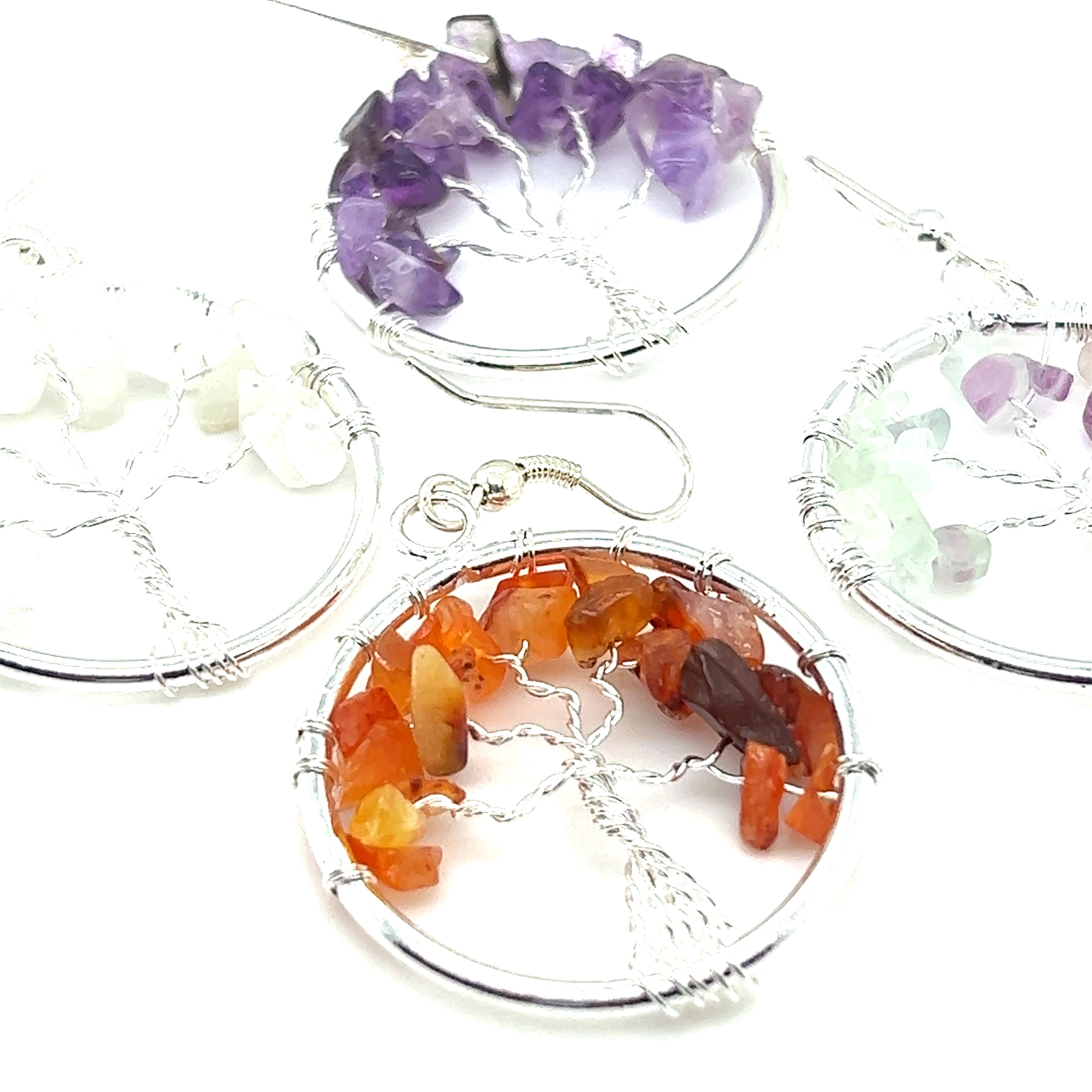 Super Silver's Gemstone Tree Earrings, inspired by the Tree of Life, are wire wrapped earrings featuring gemstones and different colored stones.