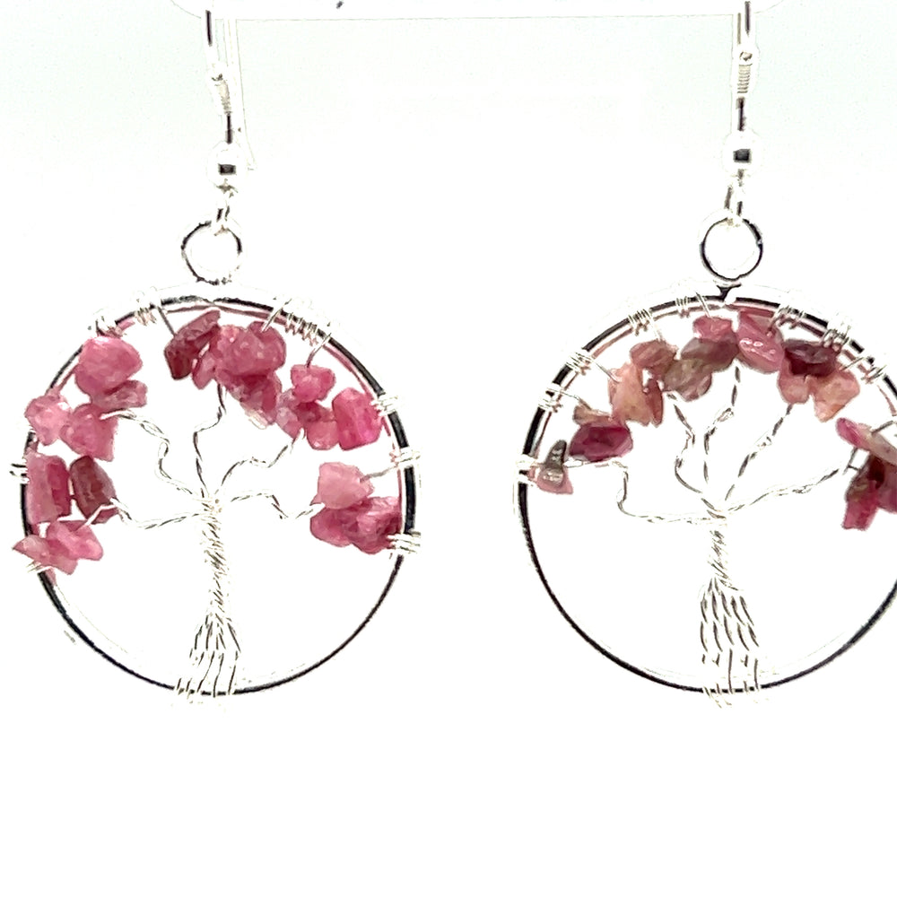 
                  
                    A pair of Gemstone Tree Earrings wire wrapped with a Tree of Life design by Super Silver.
                  
                
