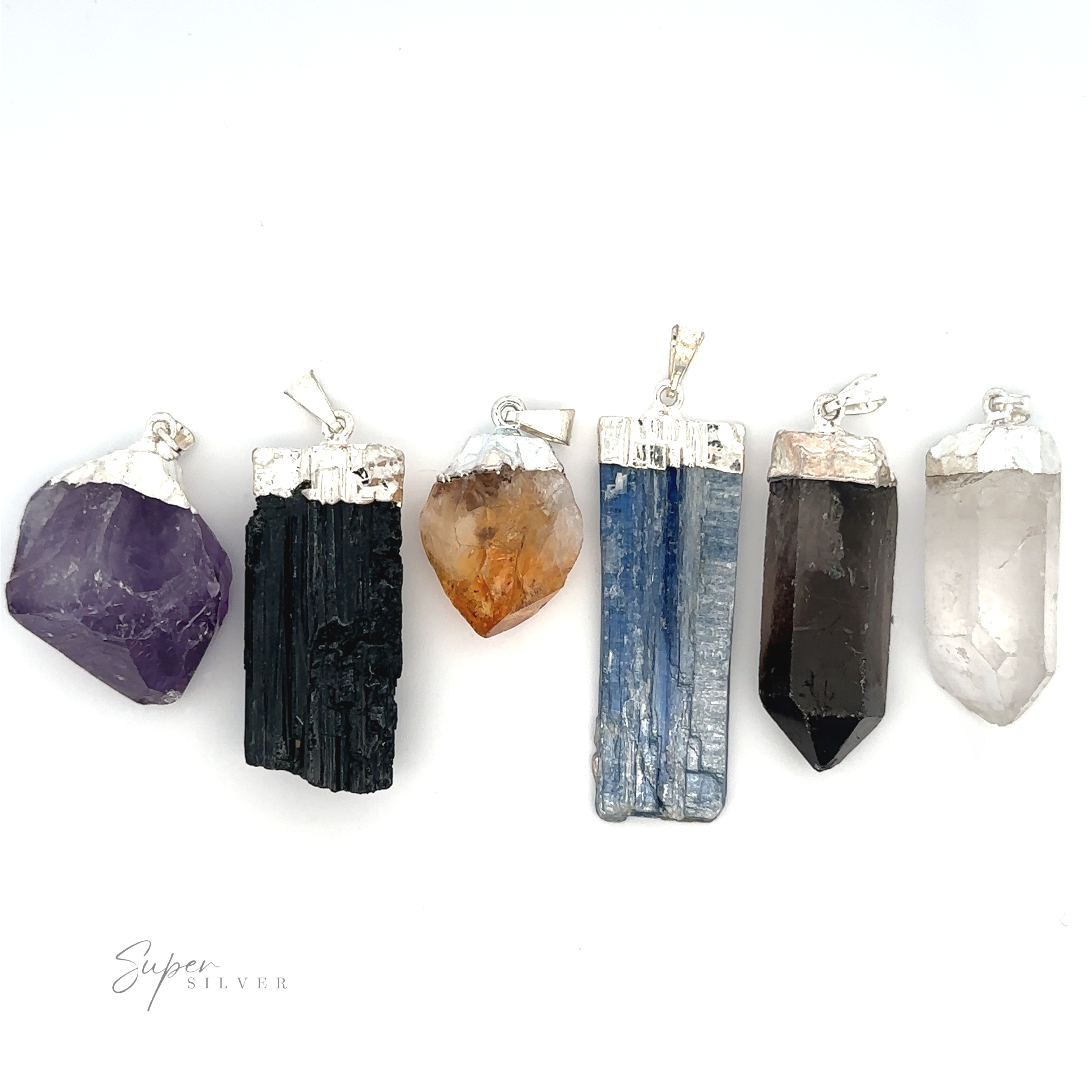 Six Raw Crystal Pendant With Silver Cap, aligned in a row against a white background. The various stones include amethyst, black tourmaline, citrine, kyanite, smoky quartz, and clear quartz.