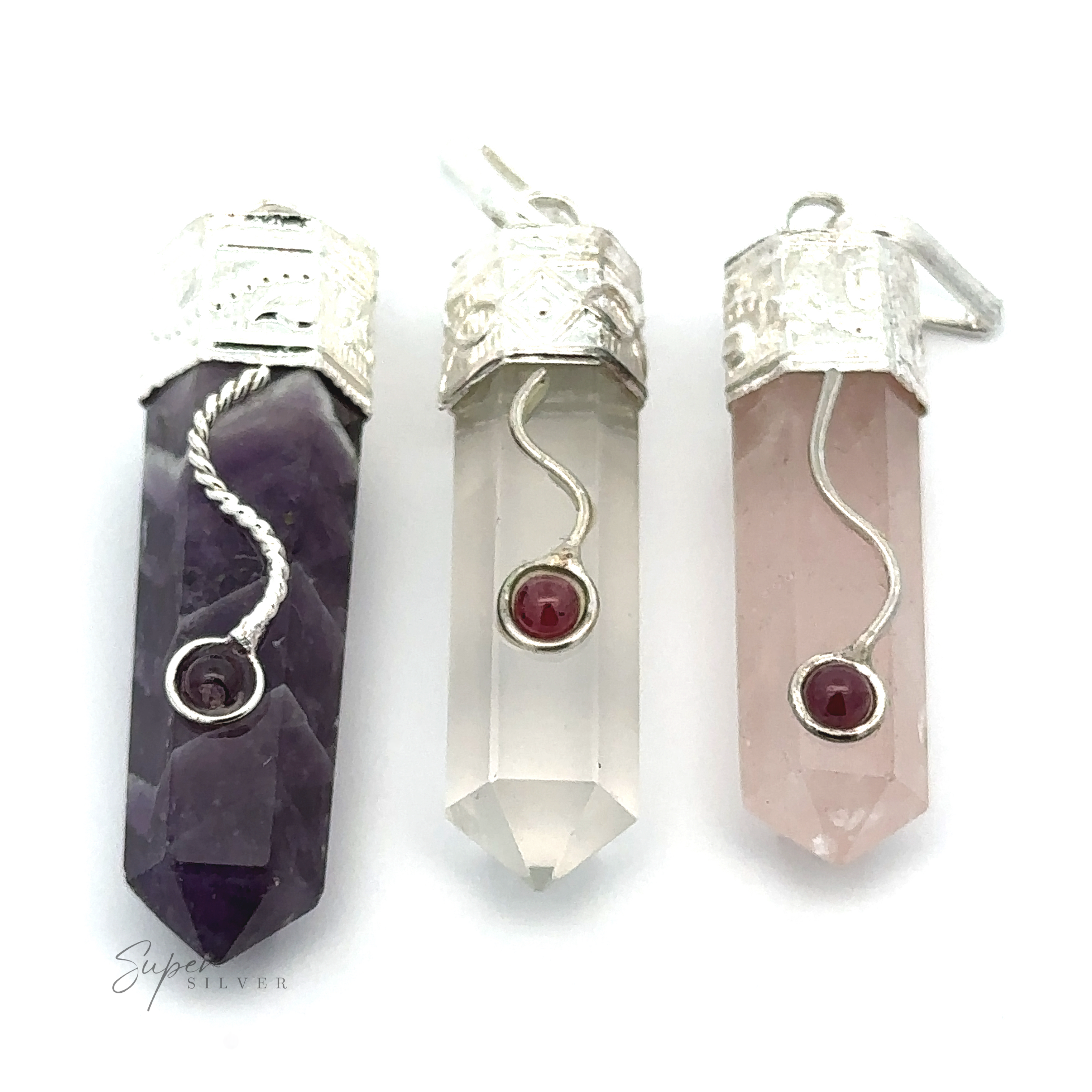 Three Crystal Pendants with Decorative Bails, each featuring a small garnet detail at the center. The crystals are purple, clear, and rose quartz.