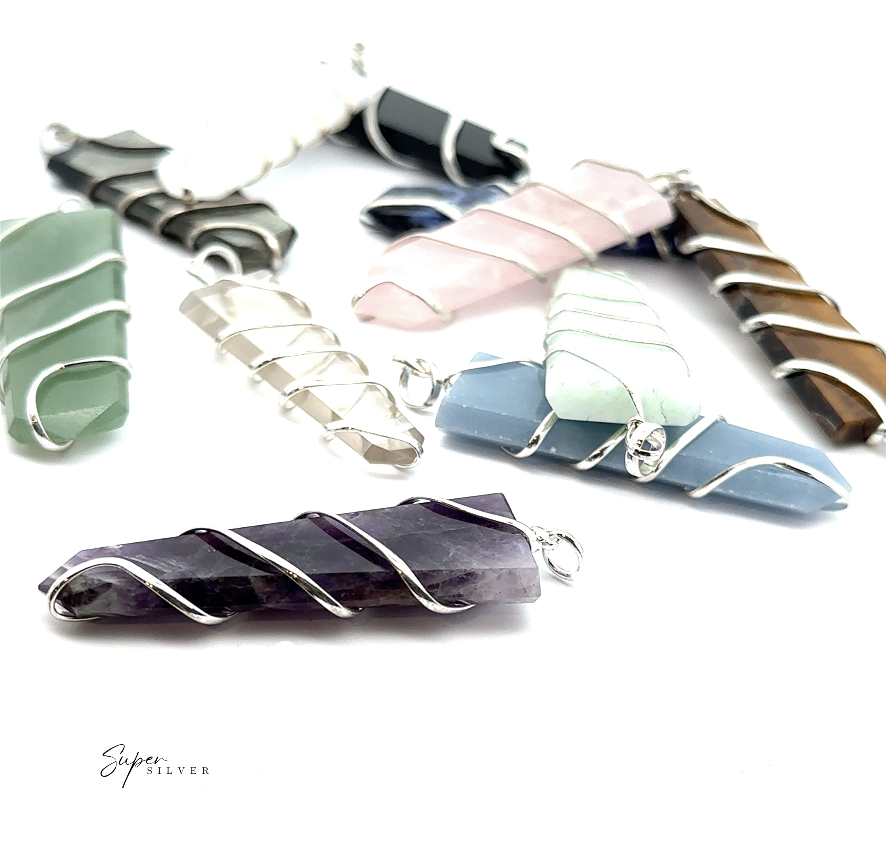 Eight Wire Wrapped Slab Pendants in assorted colors and mixed metal wire are displayed on a white background.