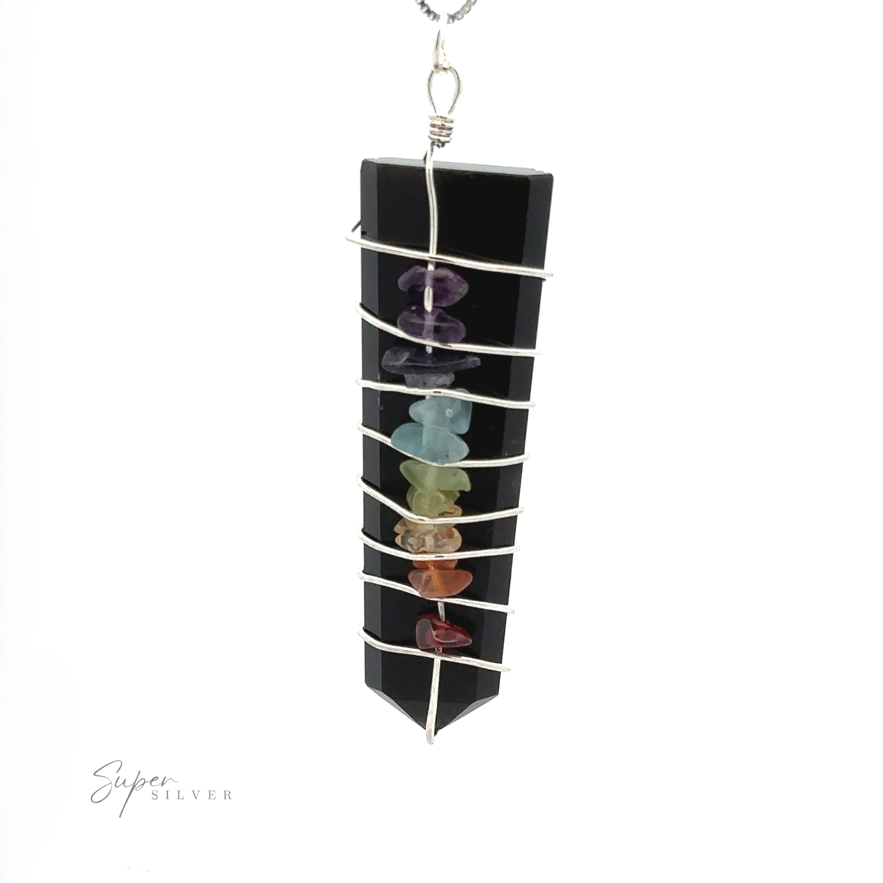 A black pendant wrapped in silver wire, featuring six small chakra stones in a vertical line, creating a striking piece for those who appreciate the beauty of the Stone Slab Wire-Wrapped Chakra Pendant.