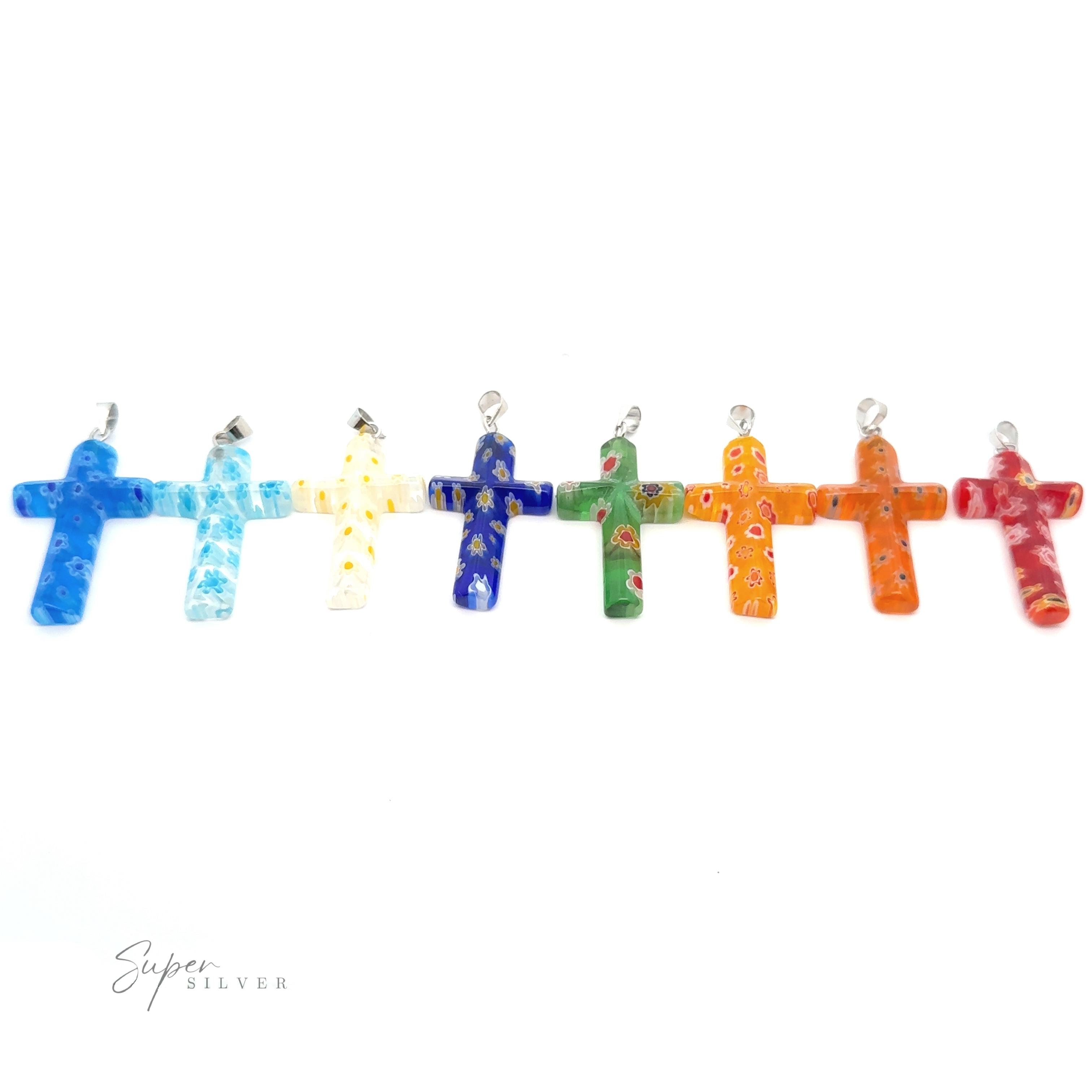 A row of colorful Cross Pendants with Flower Patterns, including mixed metals and translucent resin crosses with flower patterns, each featuring a silver loop on top, displayed against a white background.