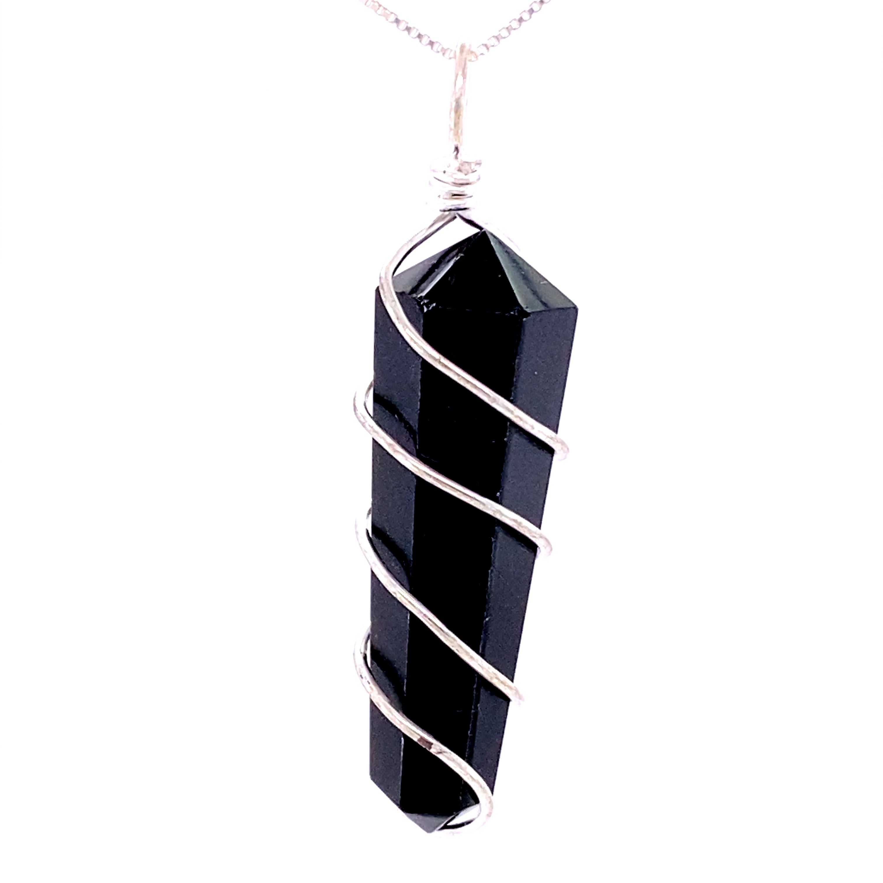 The Wire Wrapped Stone Pendant is a genuine stone necklace showcasing a black crystal pendant intricately wrapped in silver wire, all suspended from a delicate chain.