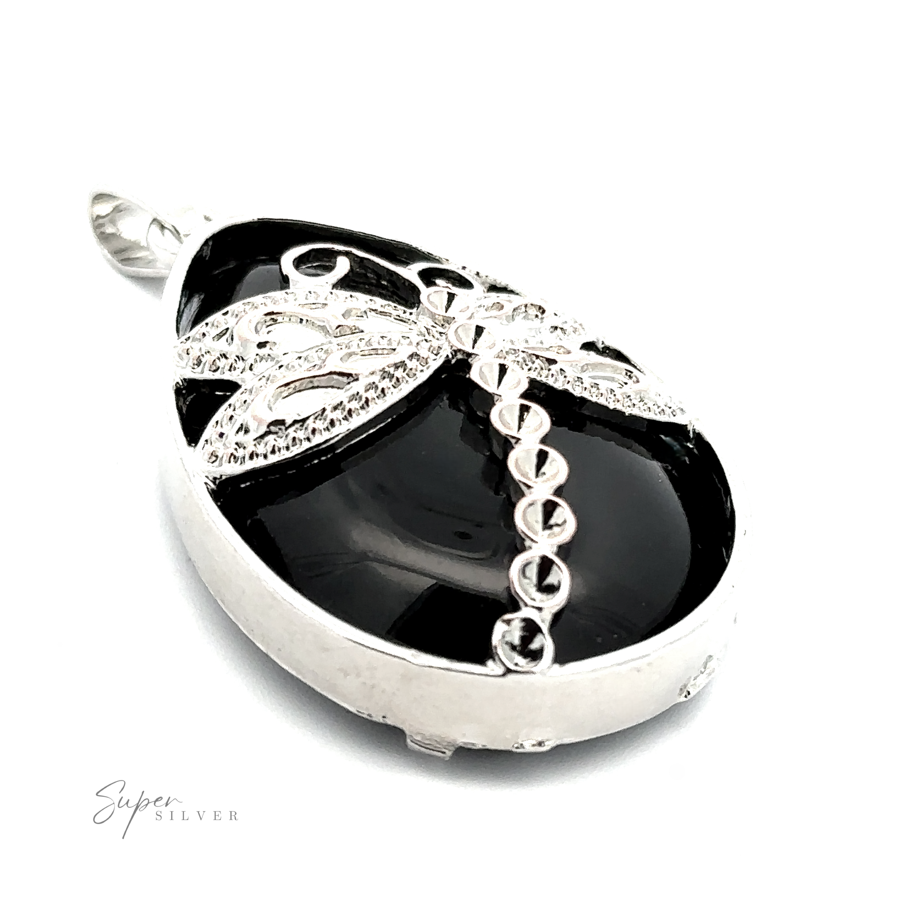 A black oval pendant with silver detailing features a teardrop shaped stone at its center, adorned by a dragonfly design. It has a loop for a chain and "Teardrop Stone pendant with Dragonfly" engraved in the bottom left corner of the image.