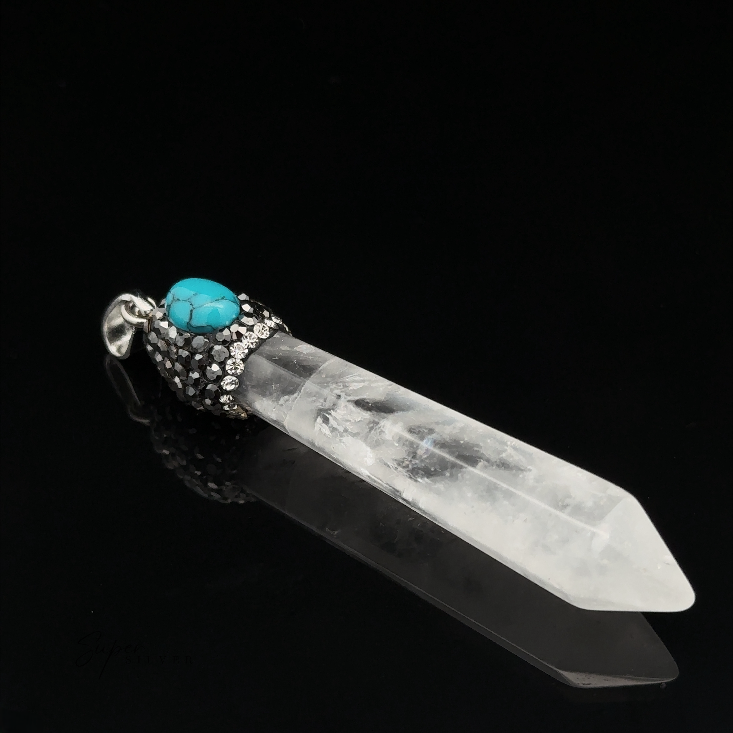 An Stone Obelisk Pendant featuring a clear quartz with a turquoise stone and hematite beads against a black background.