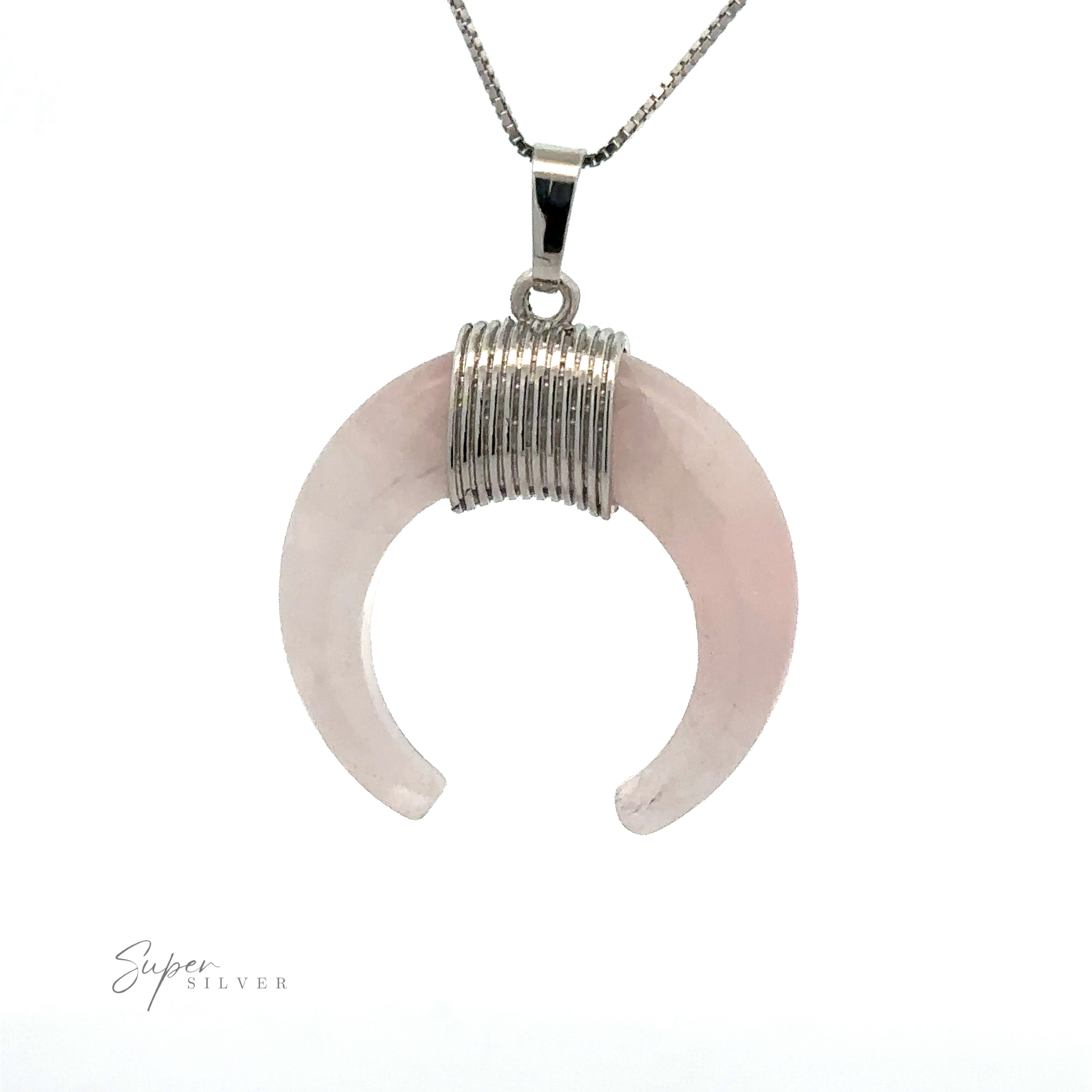 A Naja Stone Pendant featuring a light pink stone wrapped with mixed metals for a unique, elegant touch.