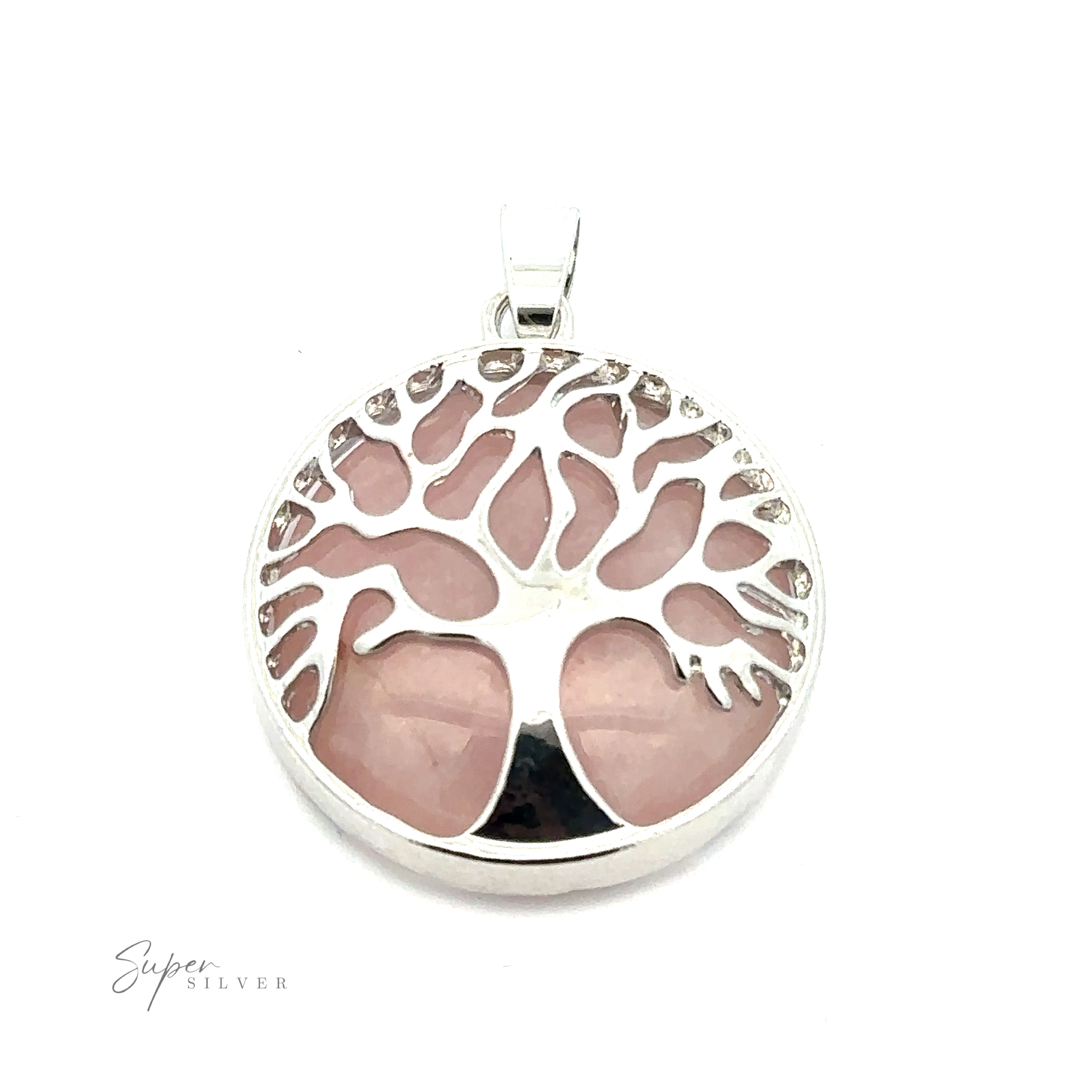 A Tree of Life Pendant featuring a Tree of Life design with branching limbs over a pink gemstone background. The pendant has a small loop for a chain, and the text "Super Silver" is visible on the bottom left.