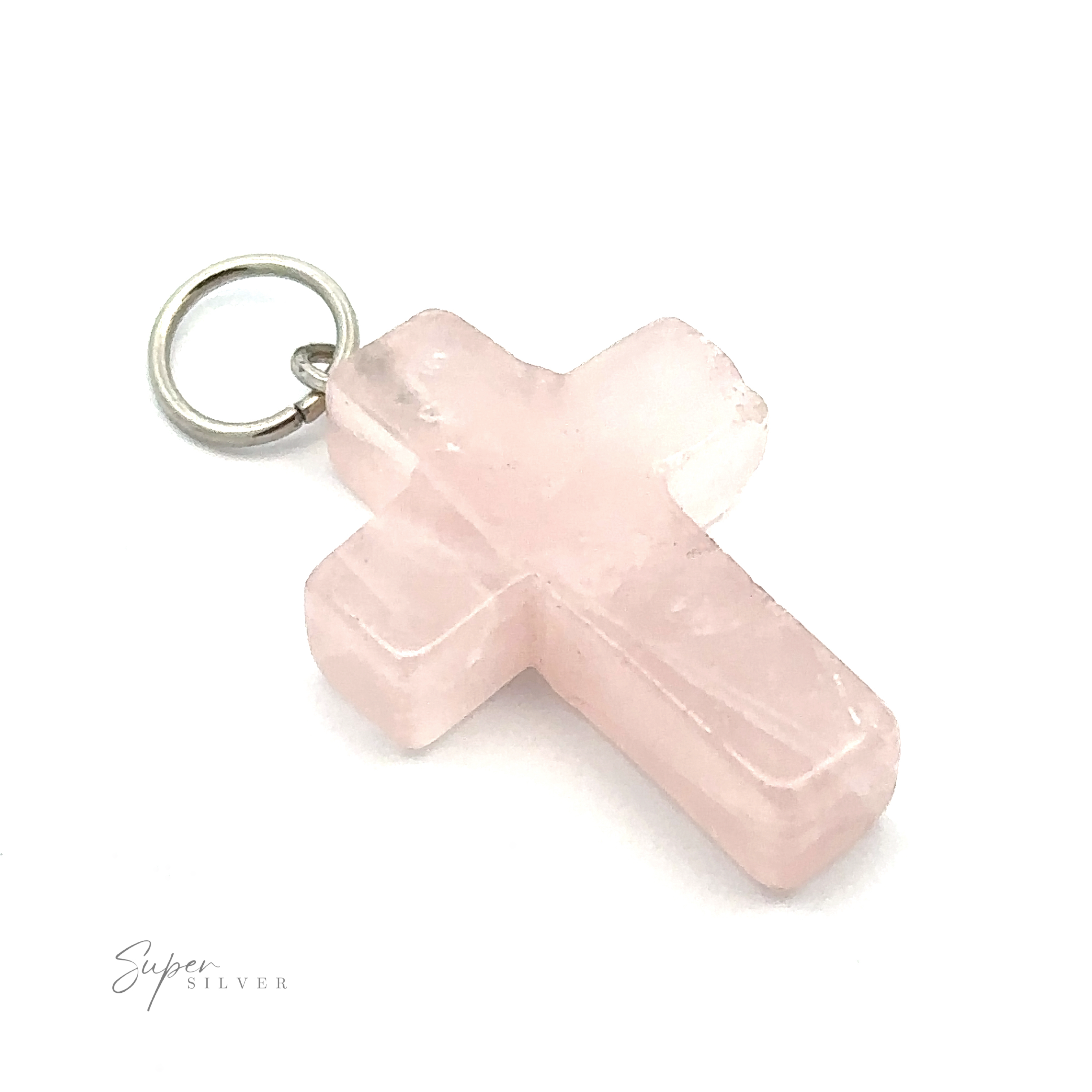 A Stone Cross Pendant featuring a light pink, rose quartz cross with a metal loop for attachment at the top. The stone cross has slightly rough, unpolished edges. The background is plain white.