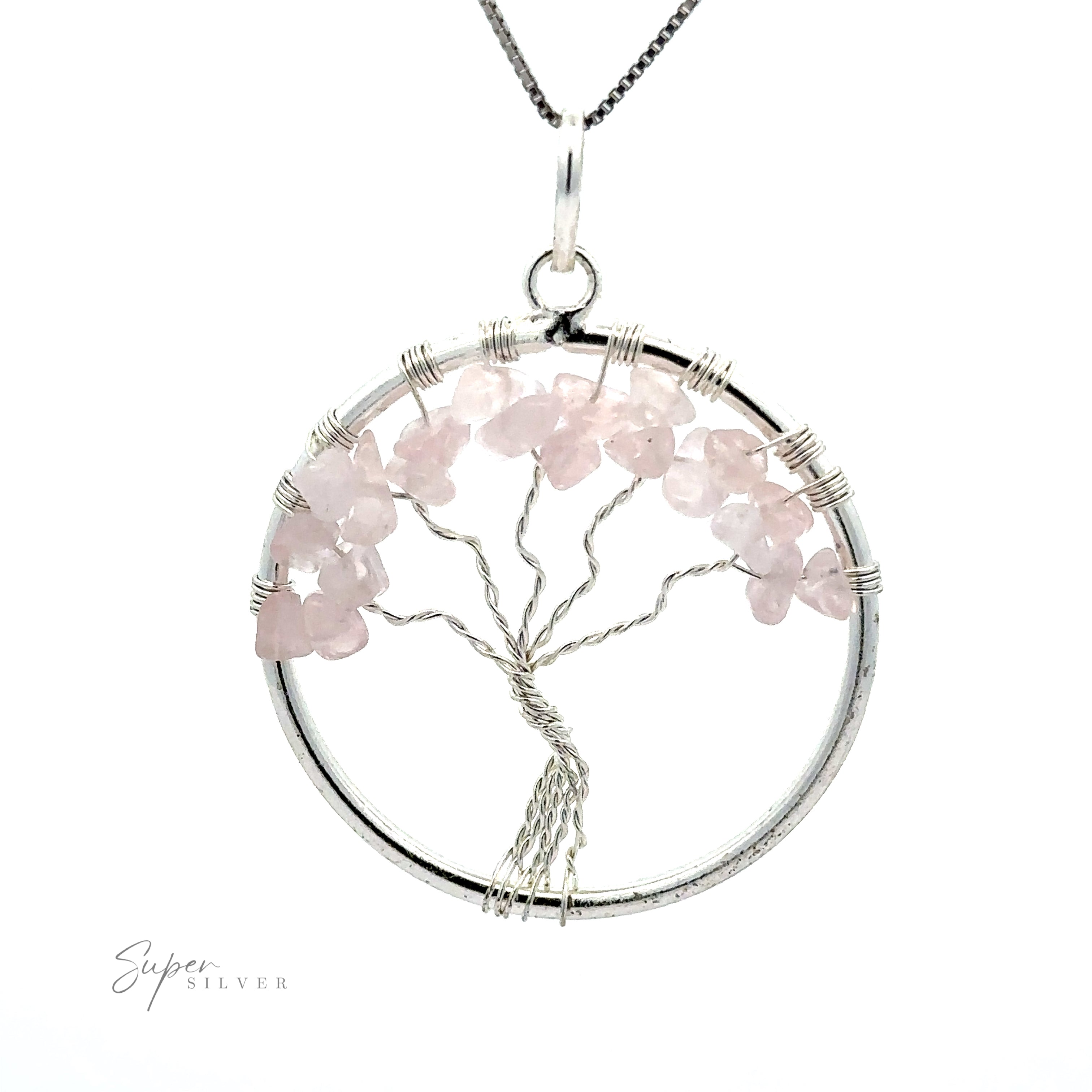 A circular silver pendant, named "Wire Wrapped Tree of Life Pendant with Stones," features a Tree of Life design made of pink gemstones and intricately wire wrapped. The pendant is attached to a silver chain, with the brand name "Super Silver" visible in the bottom left corner.