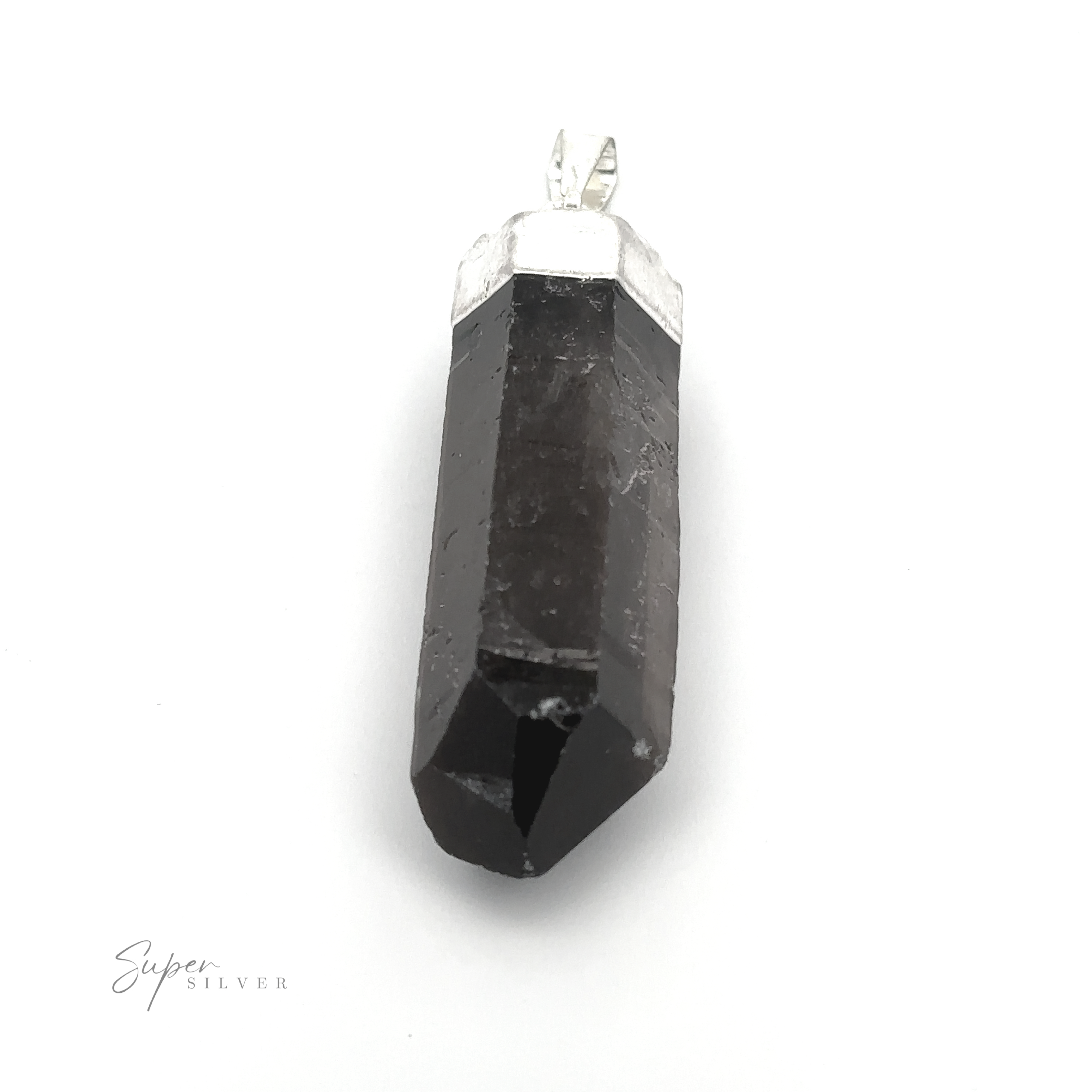 A Raw Crystal Pendant With Silver Cap featuring a black stone with a silver cap and bail on a white background. The elongated pendant is faceted at the bottom, showcasing raw crystal elegance.