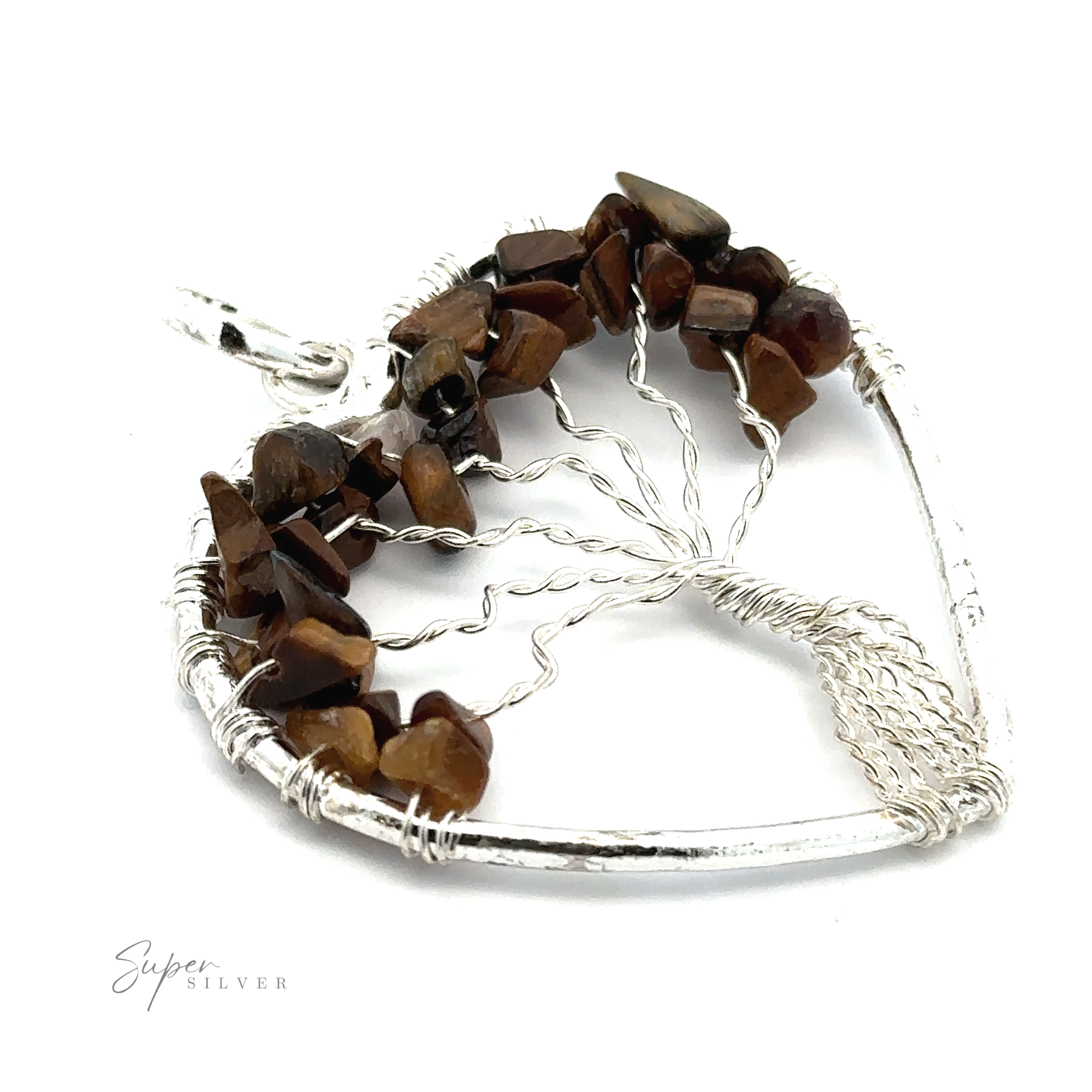 Close-up of a Heart Shaped Tree of Life Pendant with small brown gemstone chips arranged in a tree-like design.