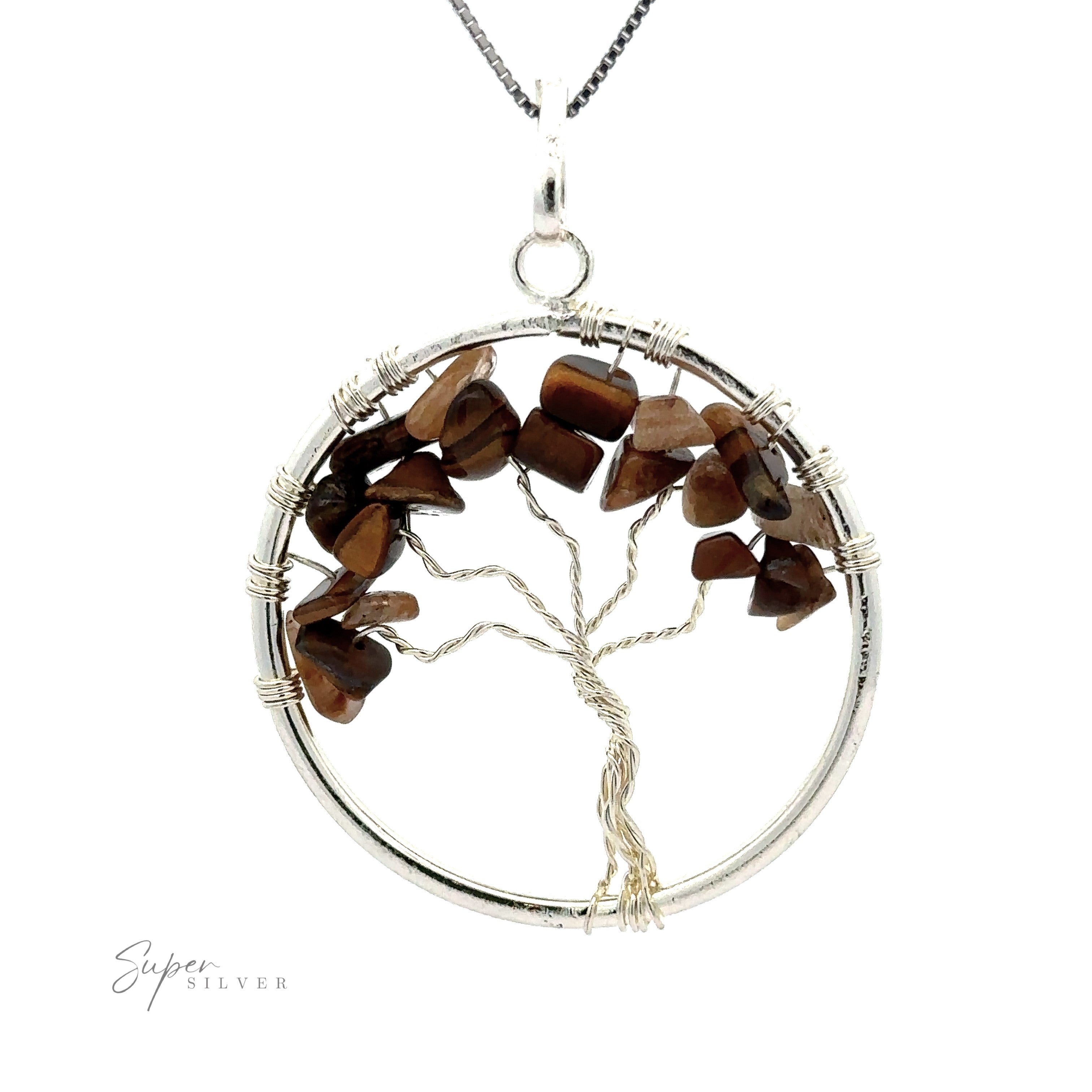 A stunning Wire Wrapped Tree of Life Pendant with Stones featuring a silver wire-wrapped tree with polished brown gemstone chips for leaves, encircled by a silver ring. The background is white.