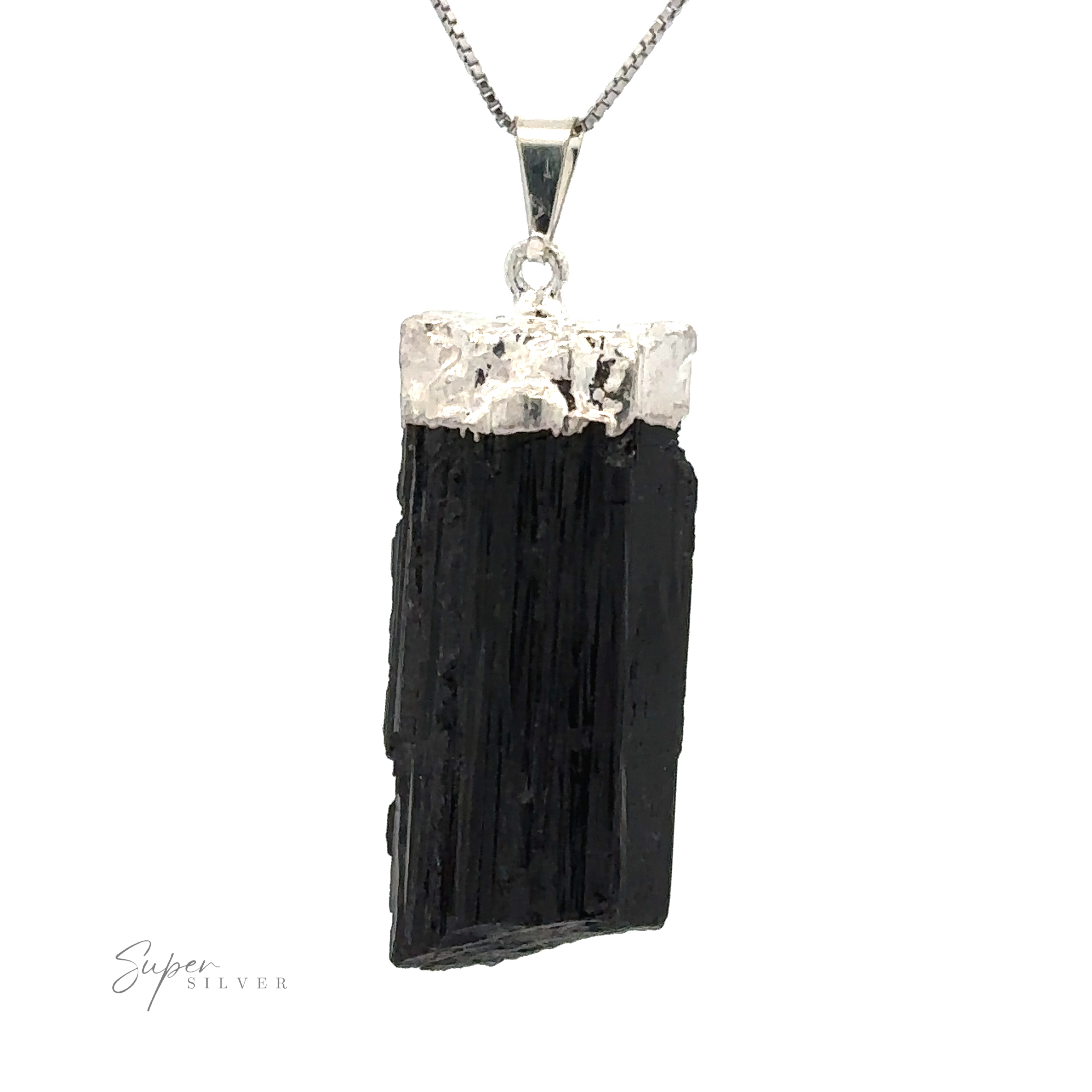 A Raw Crystal Pendant With Silver Cap featuring a raw black crystal set in a silver mount, hanging from a silver chain.