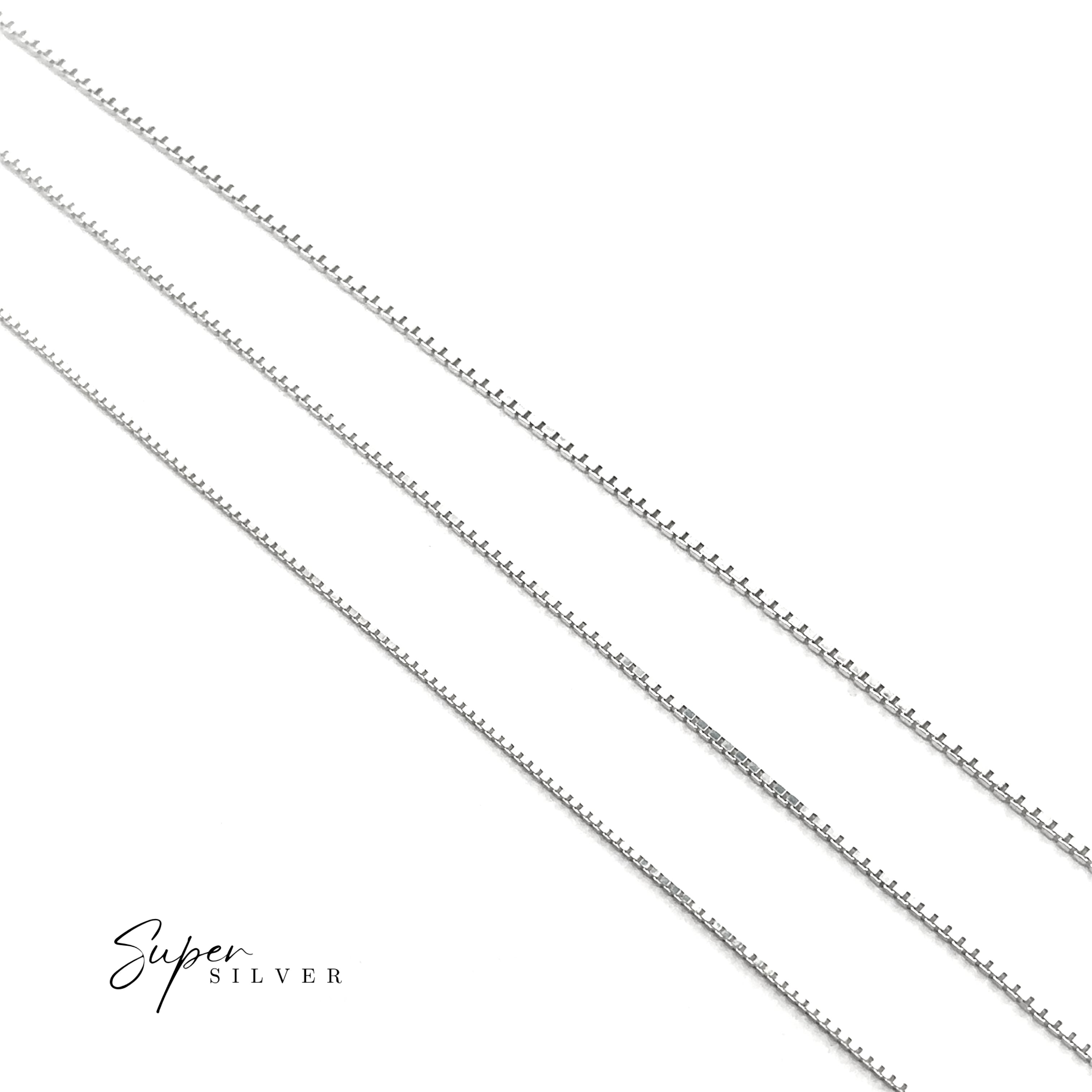 Three Delicate Sterling Silver D/C Box Chains lie parallel on a white background, highlighting refined Italian craftsmanship, with the "Super Silver" logo featured in the bottom left corner.